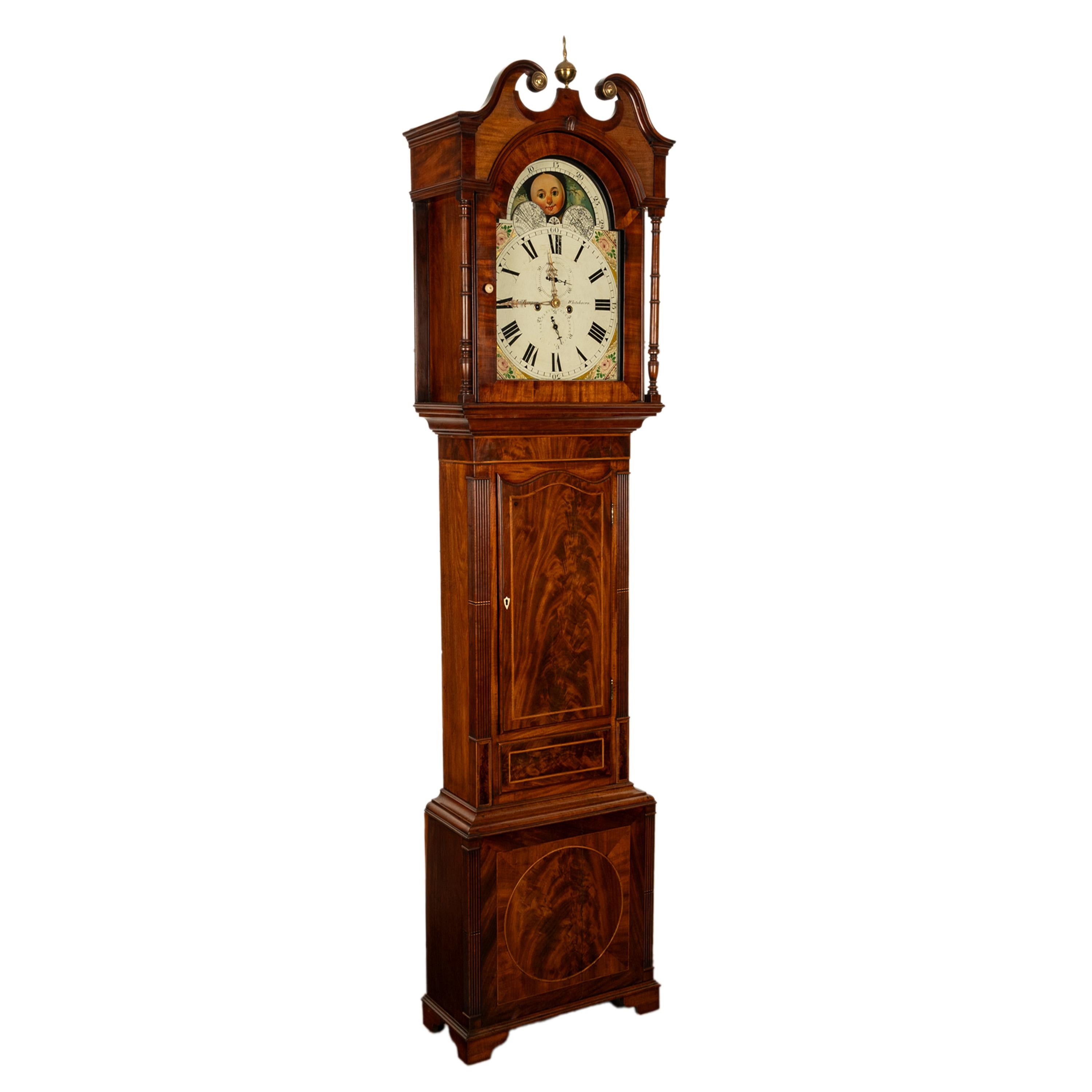 A fine antique Georgian Regency period tall case 8 day inlaid mahogany grandfather clock, by Joseph Thompson of Whitehaven, circa 1820.
The clock is made of figured flame mahogany and inlaid with ebony and satinwood stringing, the clock hood with