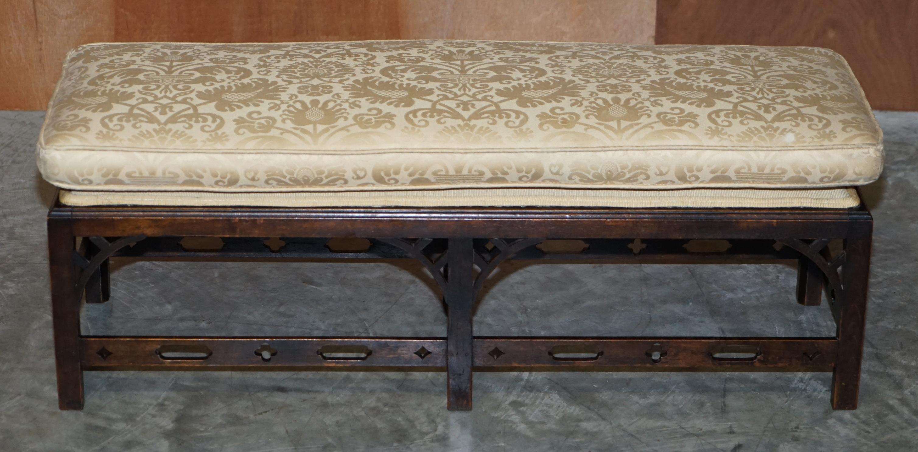 We are delighted to offer for sale this lovely circa 1800 Georgian two person bench footstool with Thomas Chippendale manner fretwork carving 

A good Georgian example in lovely original condition. The frame has a lovely fretwork carved base which