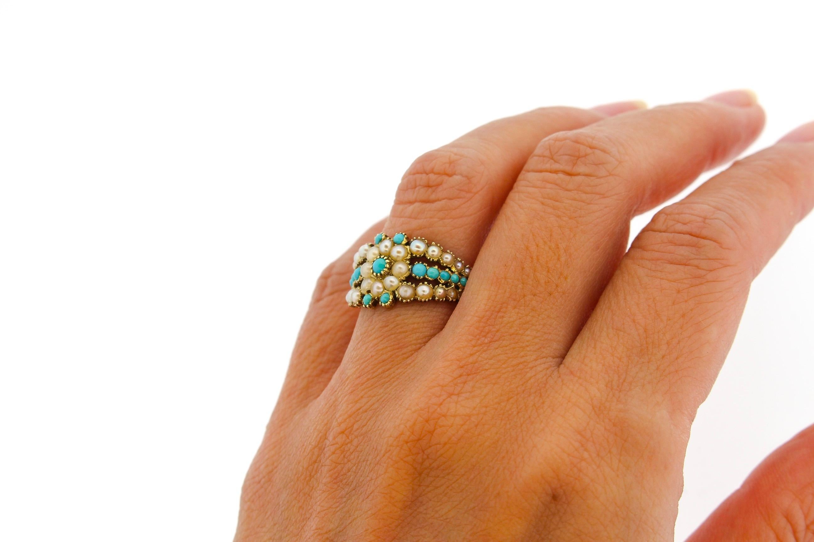 A lovely Georgian turquoise and split pearl 15k gold engraved ring. This ring is so charming with its floral design, bright colors and width. The shank is even more delightful with its heavy engraving. Absolutely a little gem of an antique ring in