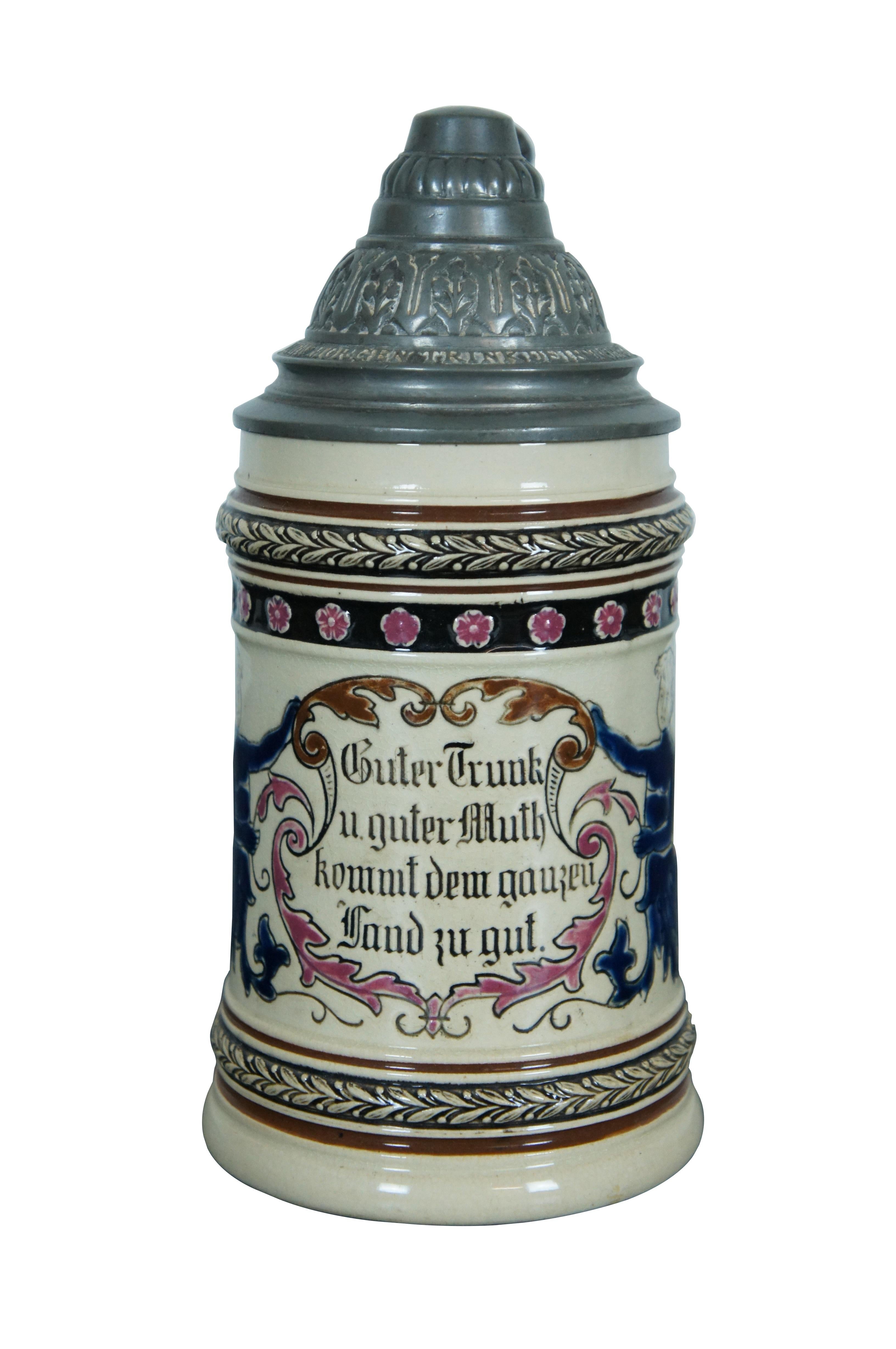 Antique German 1/2 liter stein / mug or tankard featuring a pair of cobalt blue boys with floral and acanthus swags with the phrase 