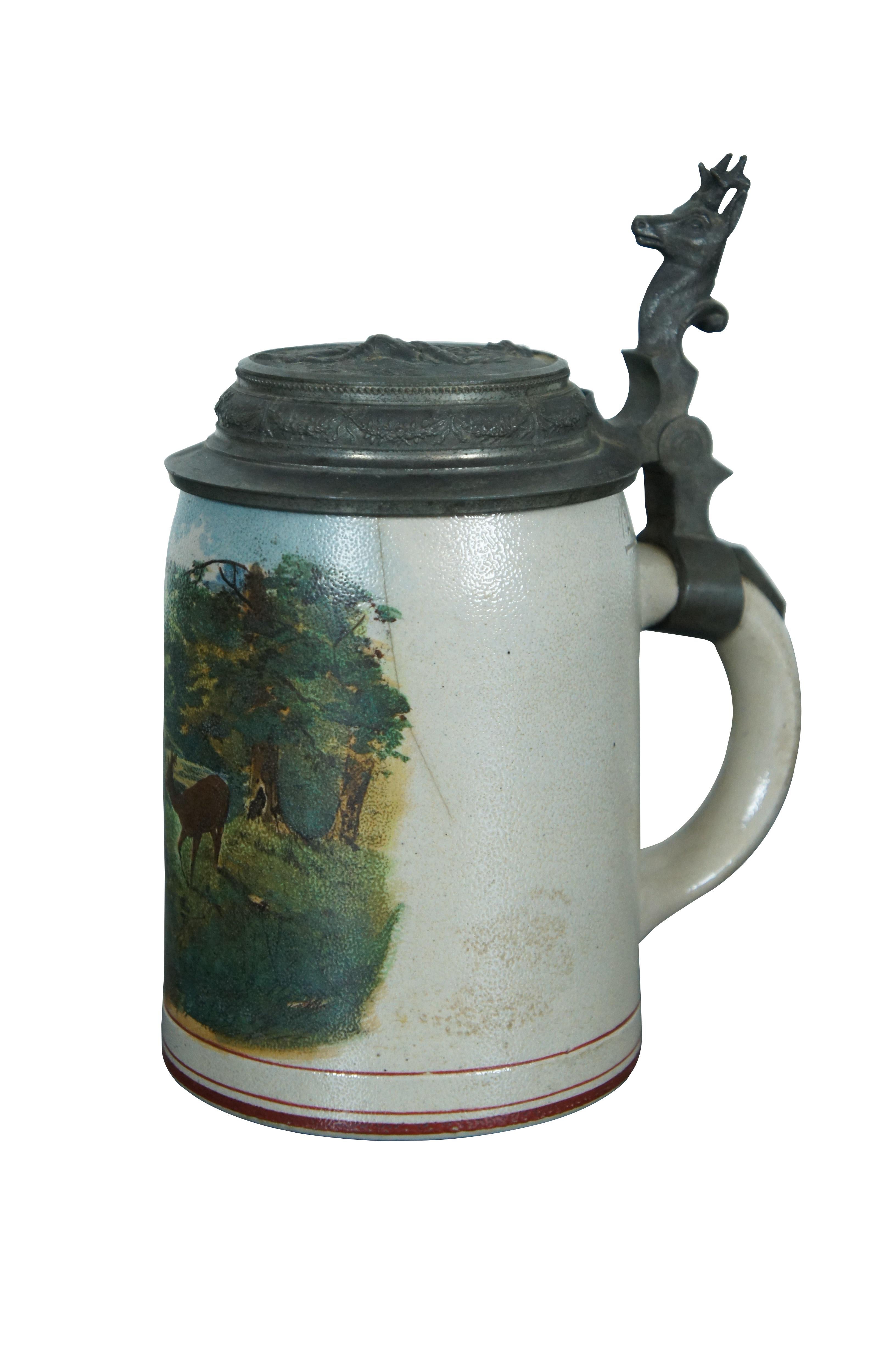 Antique German 1/2 Liter stoneware beer stein featuring a pewter lid with figural stag and landscape scene.

Dimensions:
5.25
