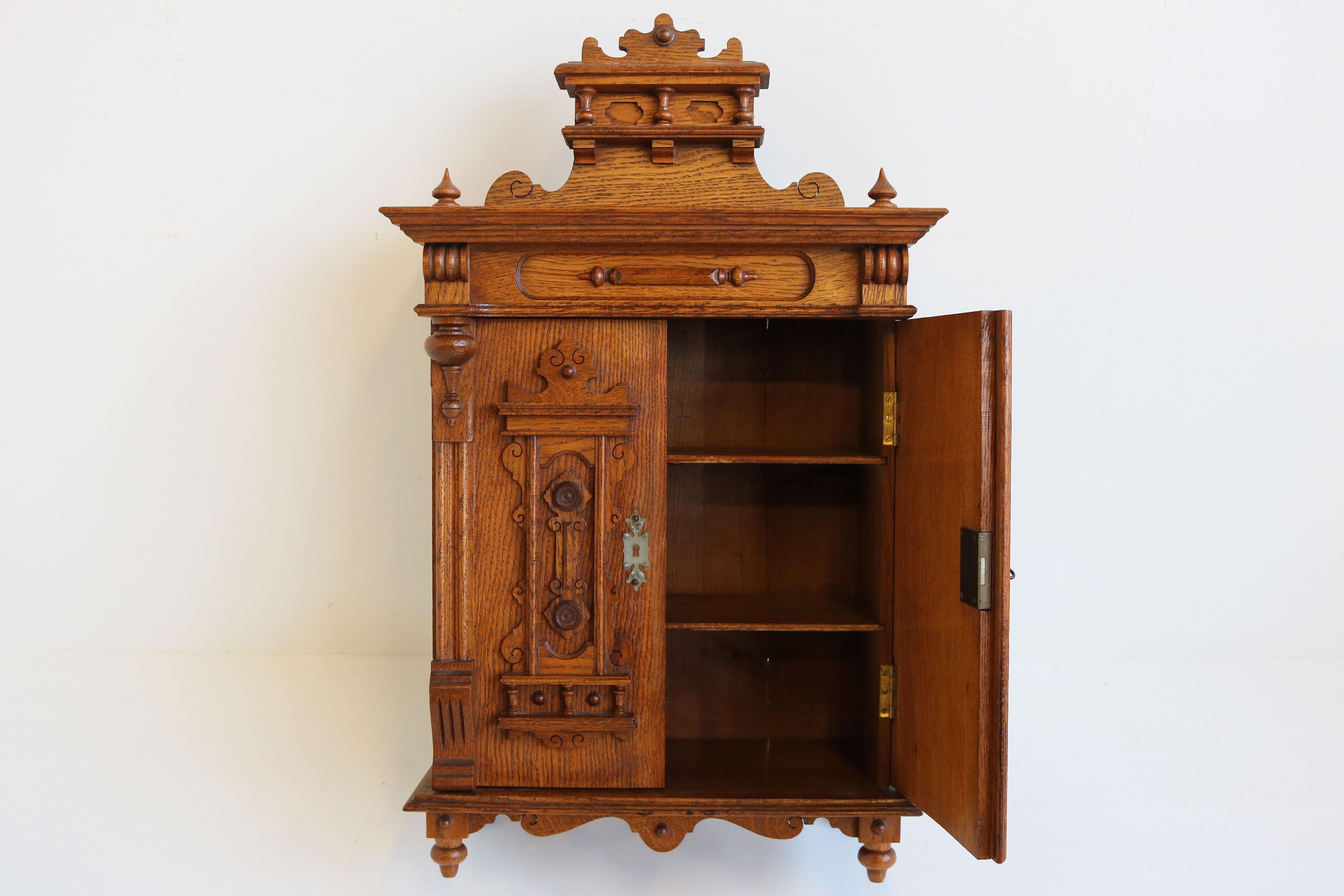Hand-Crafted Antique German 19th Century Gründerzeit Wall Cabinet Carved Oak Neo Classical For Sale