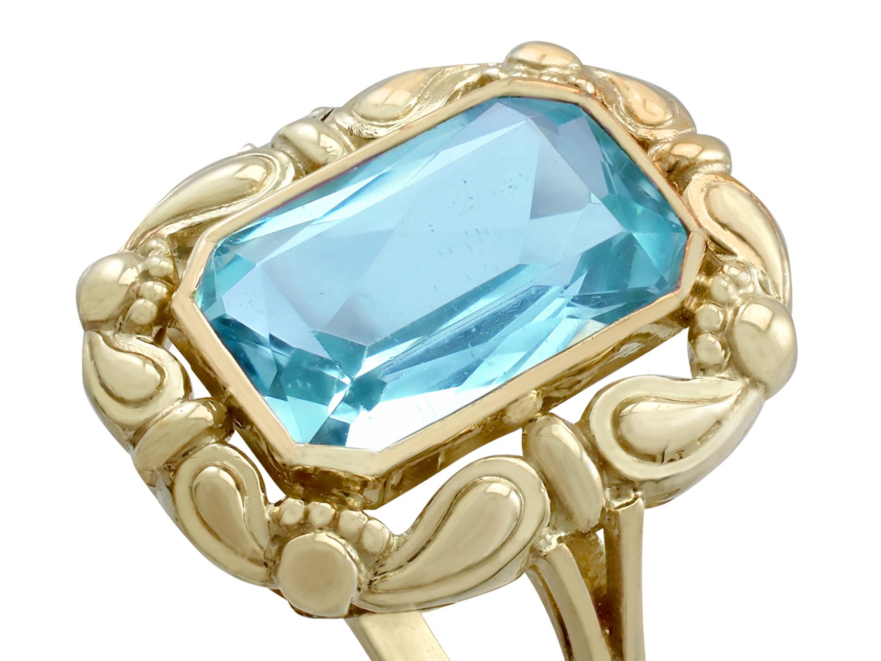 An impressive antique German 4.10 carat aquamarine, 8 karat yellow gold dress ring; part of our diverse antique jewelry and estate jewelry collections.

This stunning, fine and impressive antique gold aquamarine ring has been crafted in 8k yellow