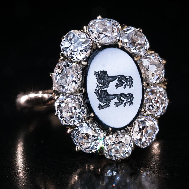 Circa 1890

This one of a kind, antique armorial engagement ring features a hematite intaglio of a dark steel gray color engraved with two walking leopards – the coat of arms of the House of Hohenlohe, a princely dynasty which belonged to the German