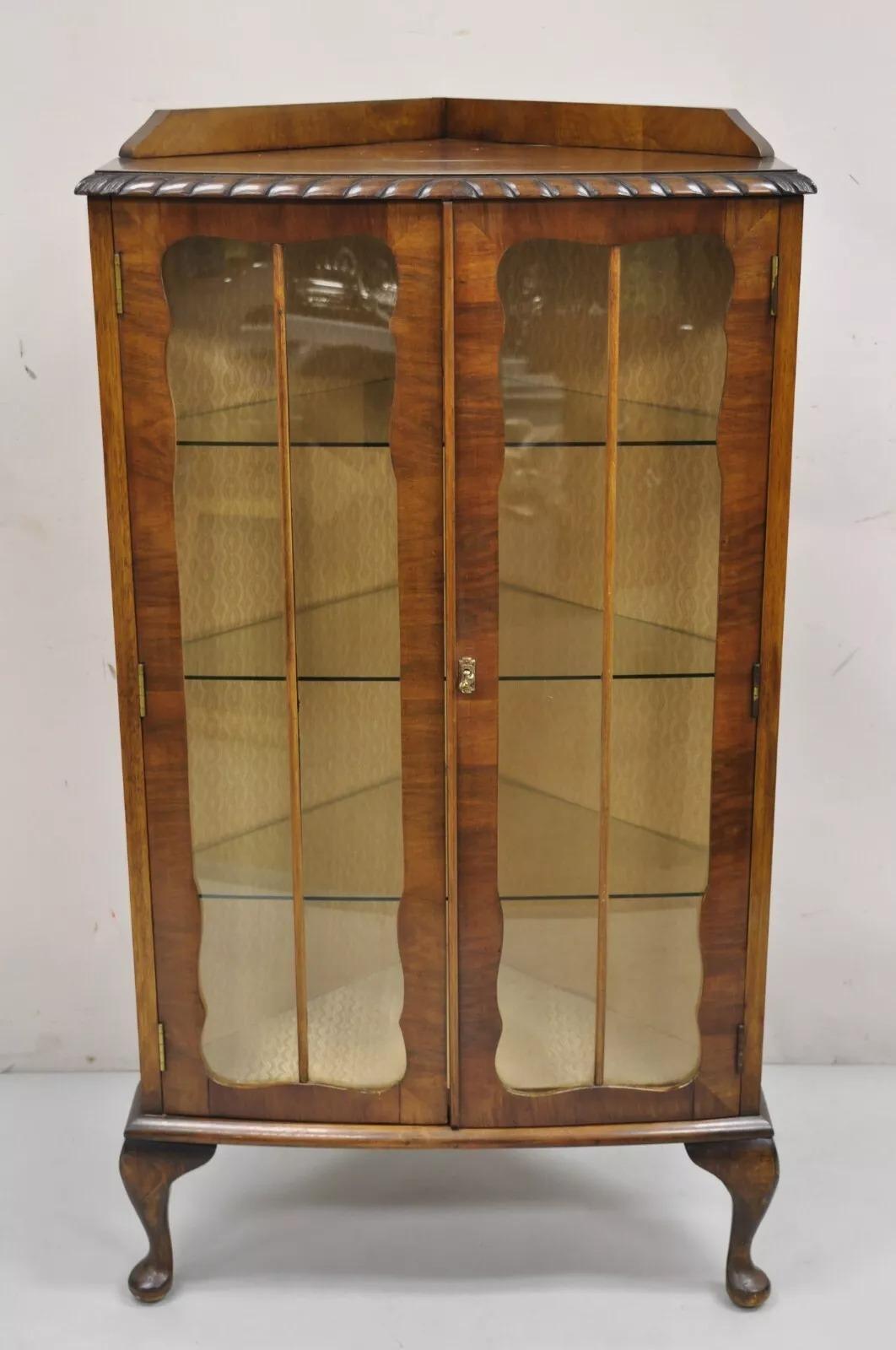 Antique German Art Deco Burl Walnut 2 Door Small Corner Curio Display Cabinet. Item features 3 glass shelves, beautiful wood grain, shapely cabriole legs, very nice antique small corner cabinet. Circa Early 20th Century. Measurements: 47