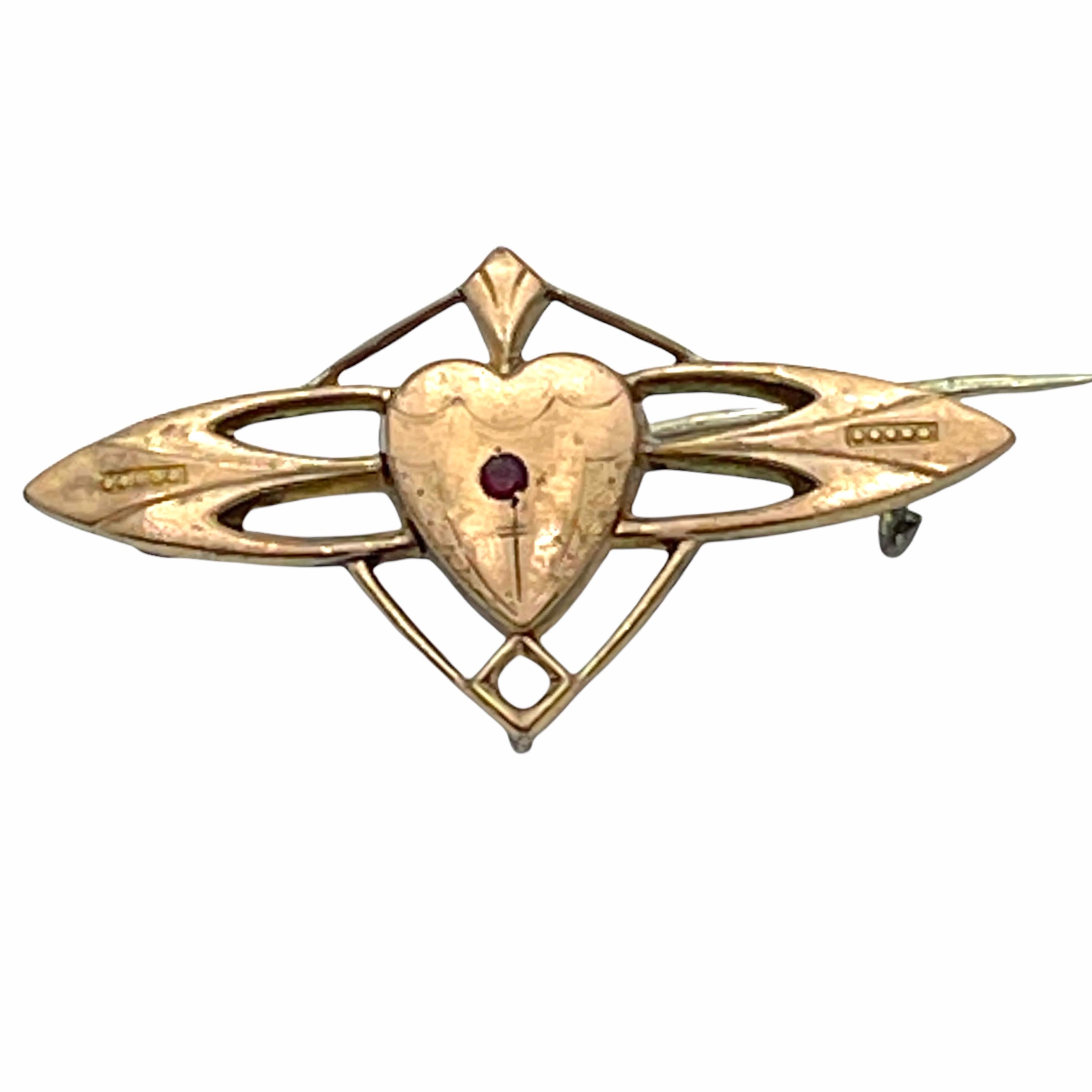 This lovely stylish sentimental brooch was made for a loved one. Made in Germany, circa 1900. The brooch has a red stone and a white stone (probably moonstone) in it.
A very pretty piece of antique jewellery which would make a fine addition to any