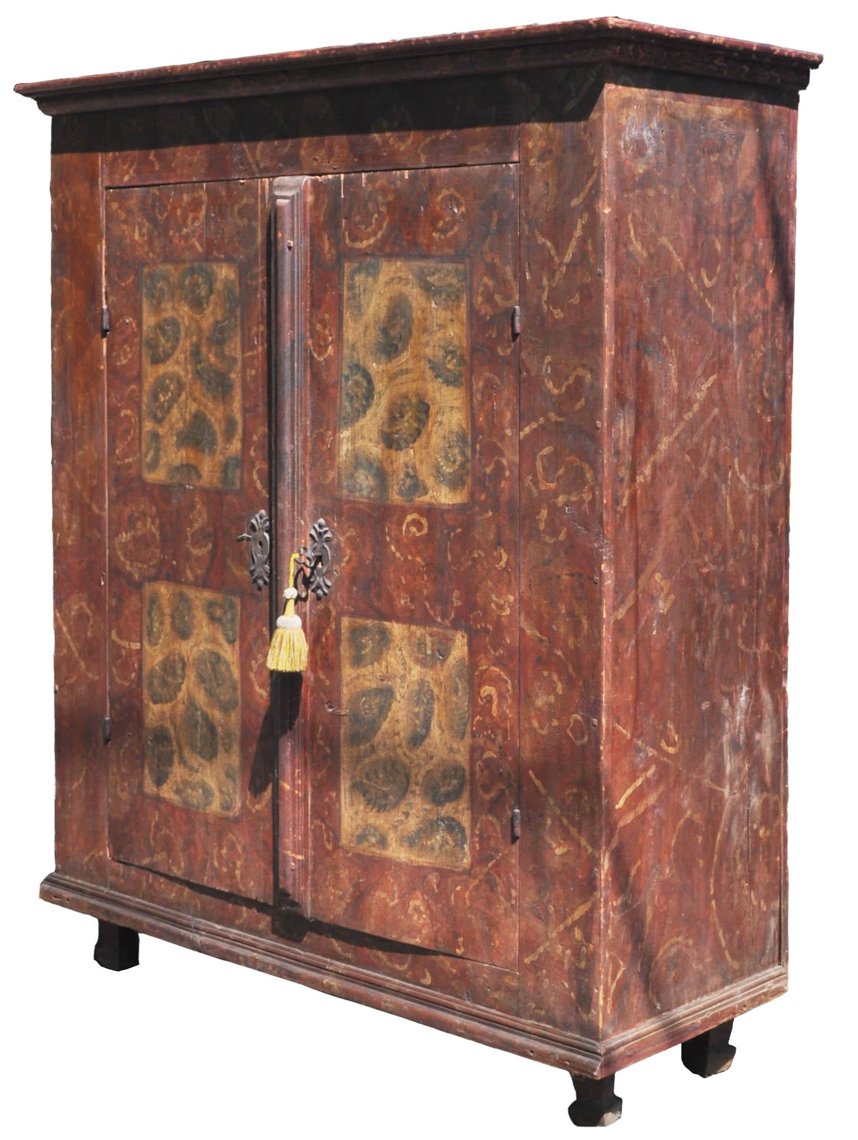 Antique German hand painted cabinet/ Armoire/ Kas, circa 1780. The cabinet is made of pine and retains the original 'sponged' paint decoration. To the top is a stepped cornice with two doors below, each door with a pair of painted panels, having the