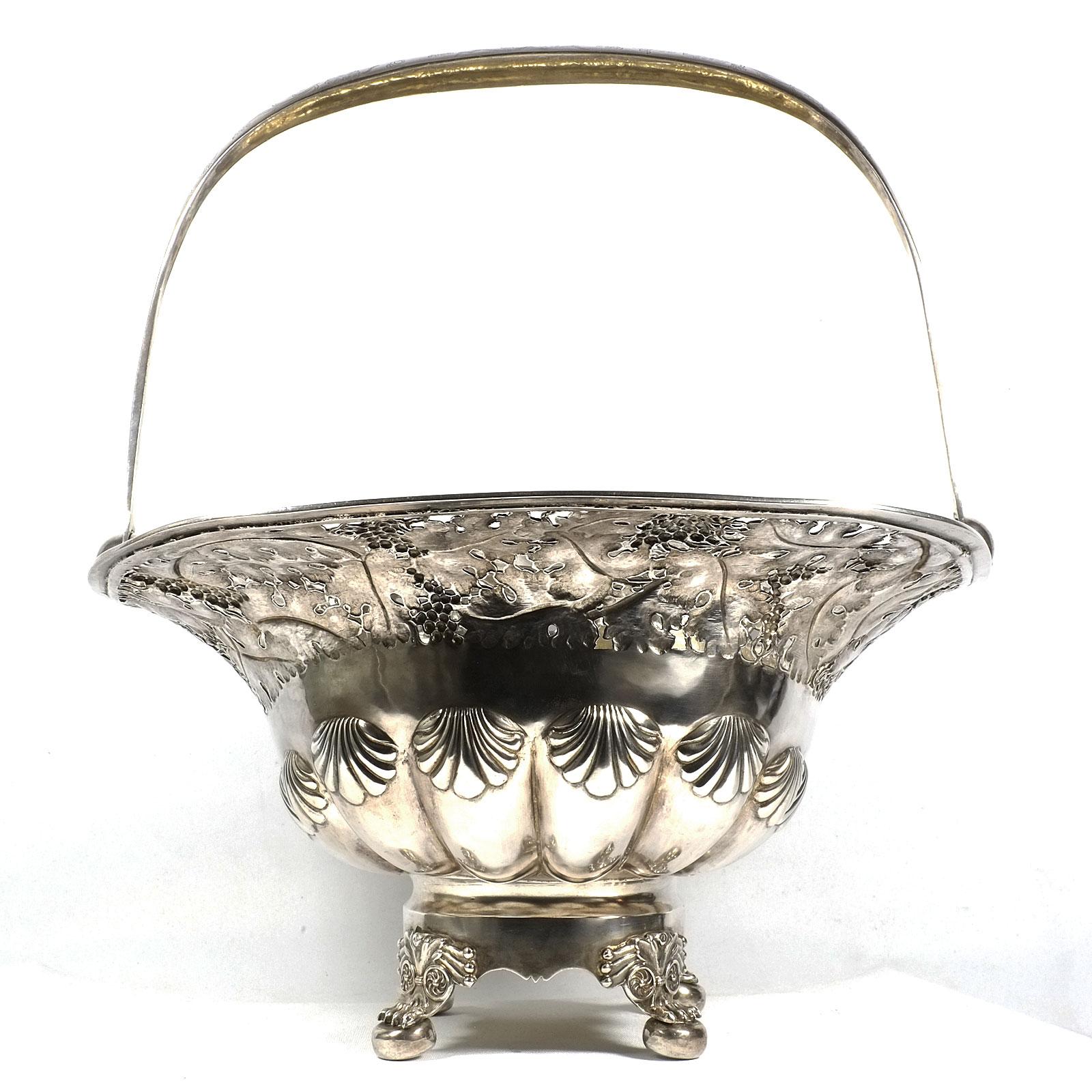 Antique German Biedermeier Silver Basket, dated 1828

Very decorative silver basket on rectangular stand on four paw feet, bulbous, gadrooned body with shell decoration, wide flared rim, pierced with vine leaf frieze. Overlapping, florally engraved