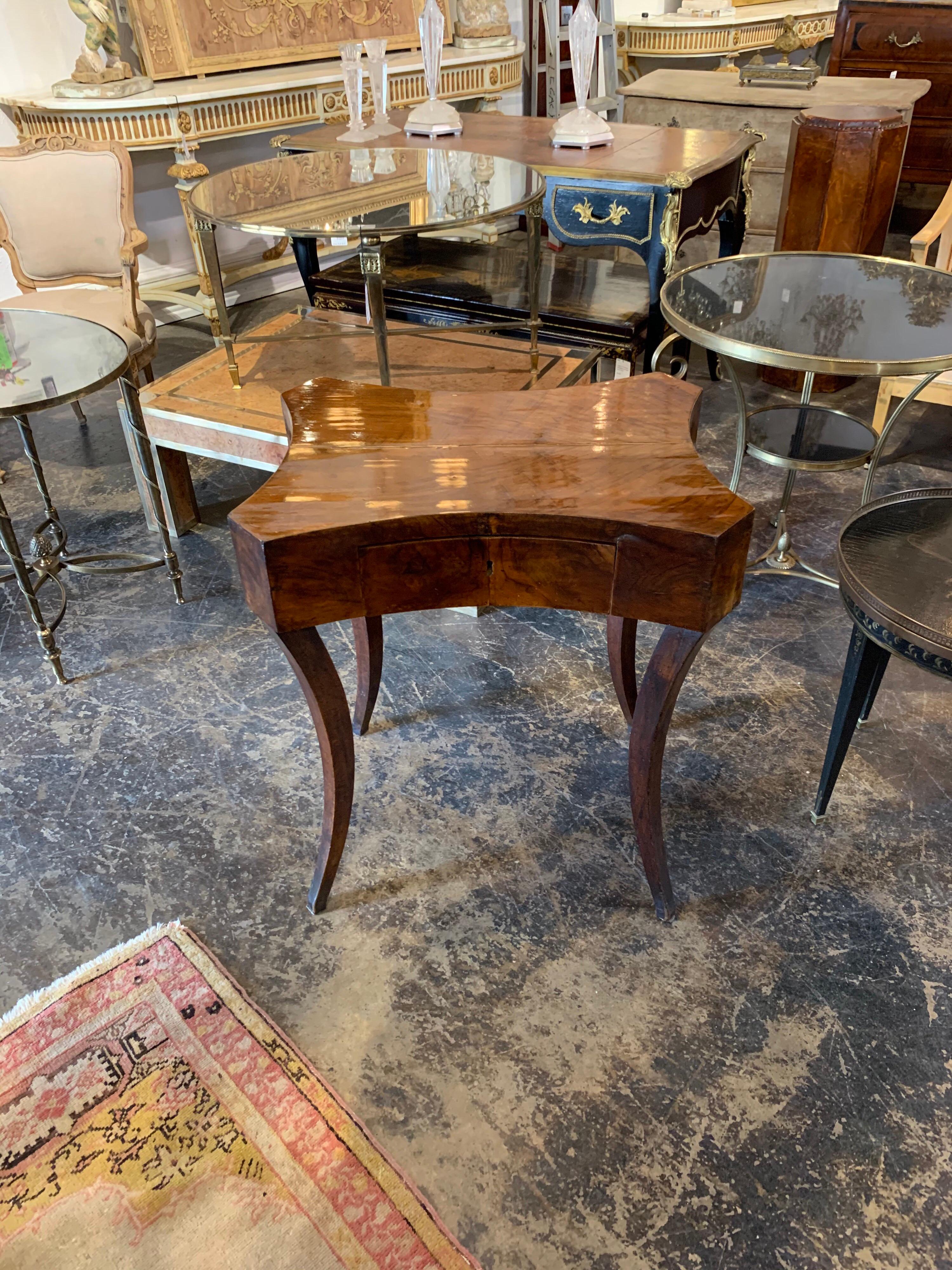 Beautiful antique German Biedermeier walnut side table with one drawer. A very sophisticated table with an amazing polished finish!