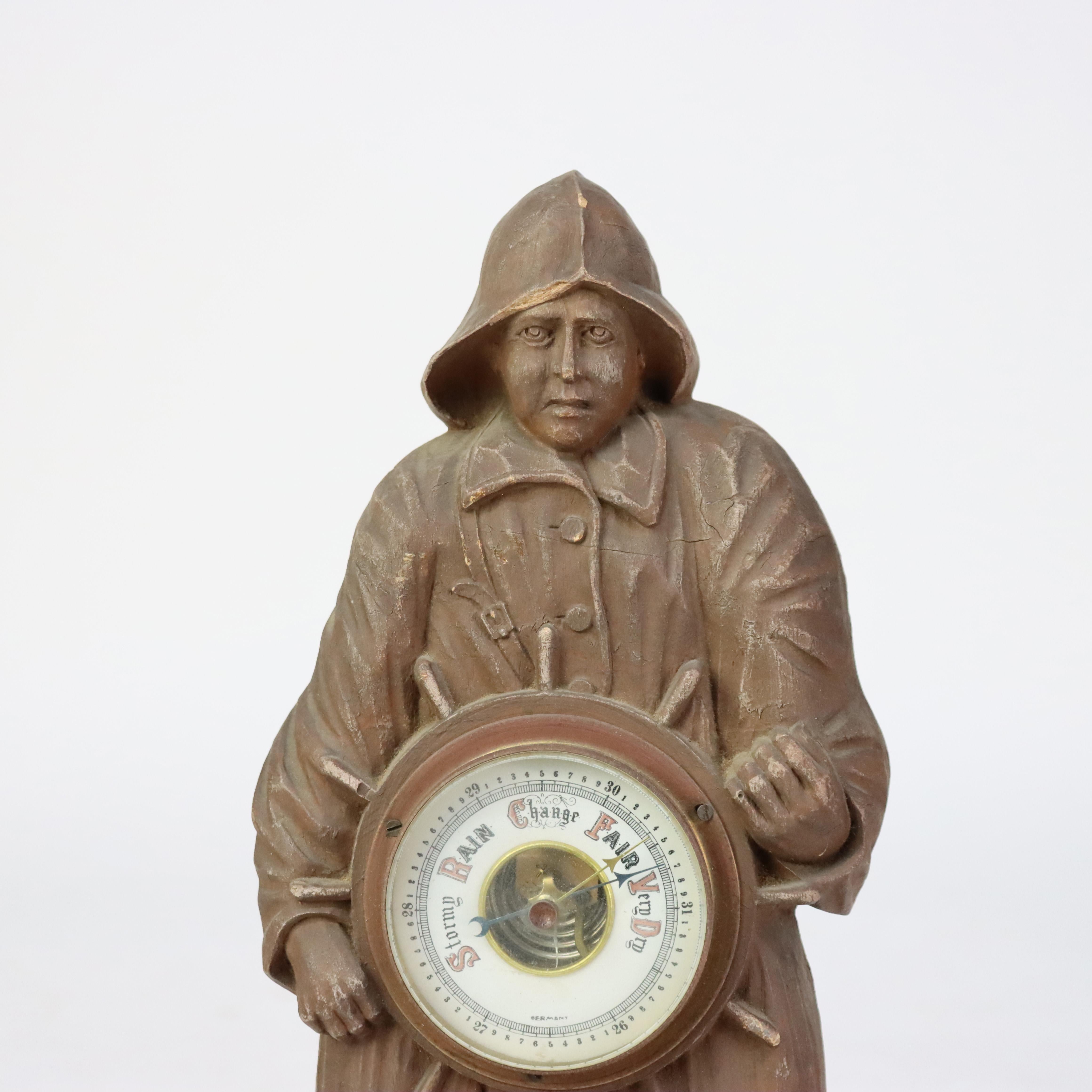 Antique German Black Forest Figural Carved Barometer with Ship Captain C1900.   

A finely carved Black Forest barometer statue from circa 1900, depicting a ship captain figure in traditional attire holding a barometer. The piece is crafted from