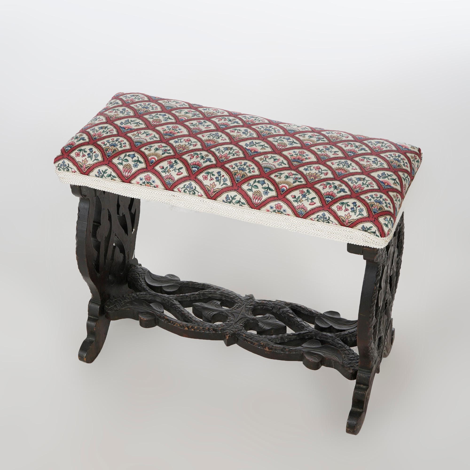 AN antique German Black Forest style bench offers upholstered seat over foliate carved trestle form base, c1890

Measures- 19''H x 22.75''W x 10.5''D.

Catalogue Note: Ask about DISCOUNTED DELIVERY RATES available to most regions within 1,500