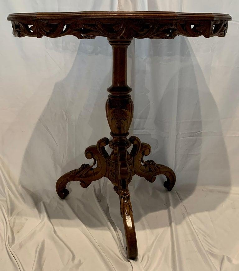 Antique German Black Forest wood-carved hunt table & 2 chairs, circa 1880-1890. Intricate carving and inlay with forest scenes.
2 chair measurements: Height - 37 inches, width - 18 1/4 inches, depth - 15 inches, seat height - 18 inches
1 table