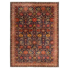 Antico tappeto tedesco blu e rosso con motivi floreali di Rug & Kilim