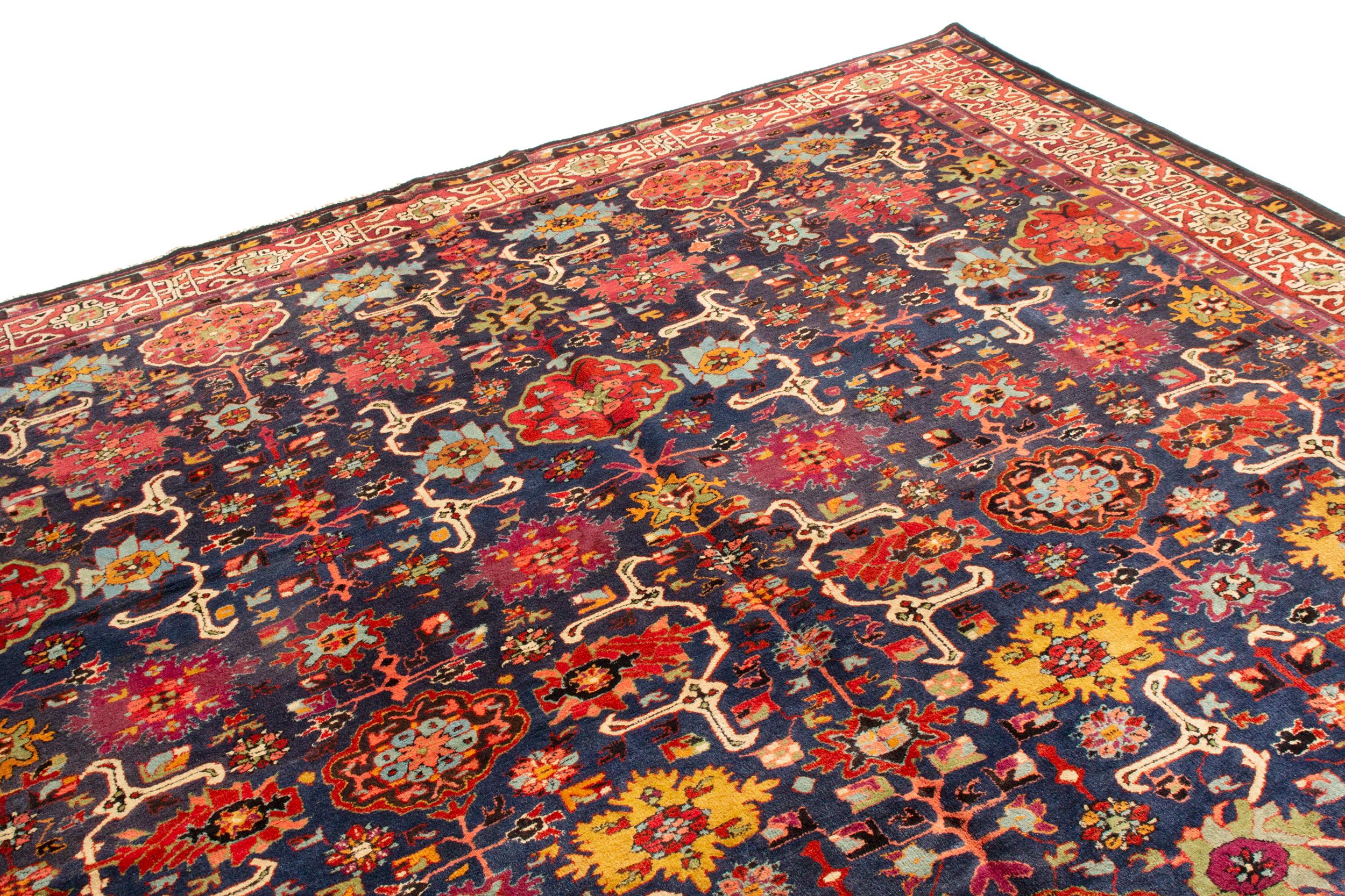 This antique German 1930s German floral has enjoys soft, finely woven wool pile. This symmetrical floral pattern is a distinct European interpretation of oriental carpets, one of several German pieces from this decade with Eastern inspiration. The