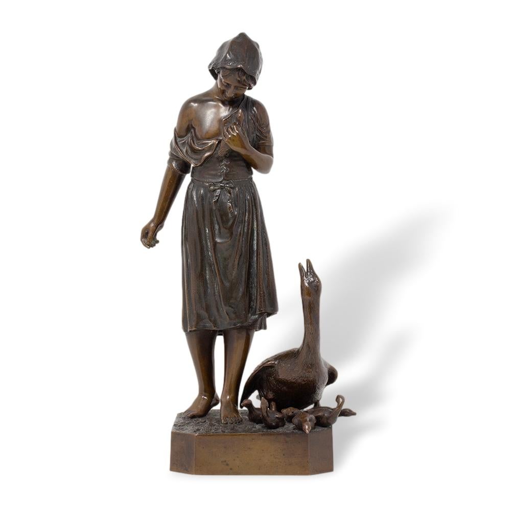 GIRL WITH GOSLINGS 

From our Antique Bronze Sculptures collection, we are delighted to offer this German Bronze Figure by Hermann Gladenbeck. The Bronze beautifully cast with a dark brown patination features a raised square plinth base with canted