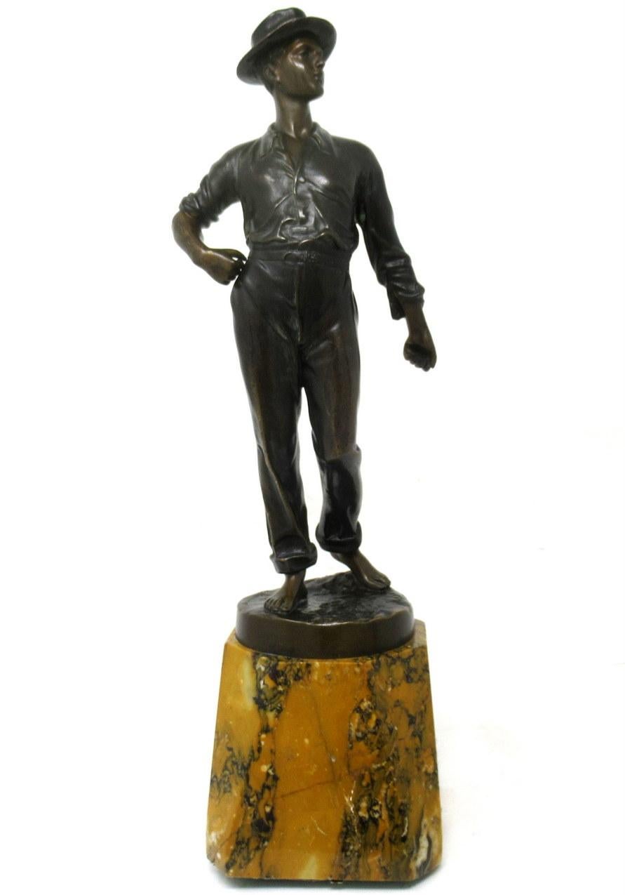 A superb example of a German well cast standing figure of a young standing gentleman on a naturalistic circular base. Late nineteenth, early twentieth Century.

The tall elegant figure shows a barefoot man wearing a long sleeve shirt, cropped long