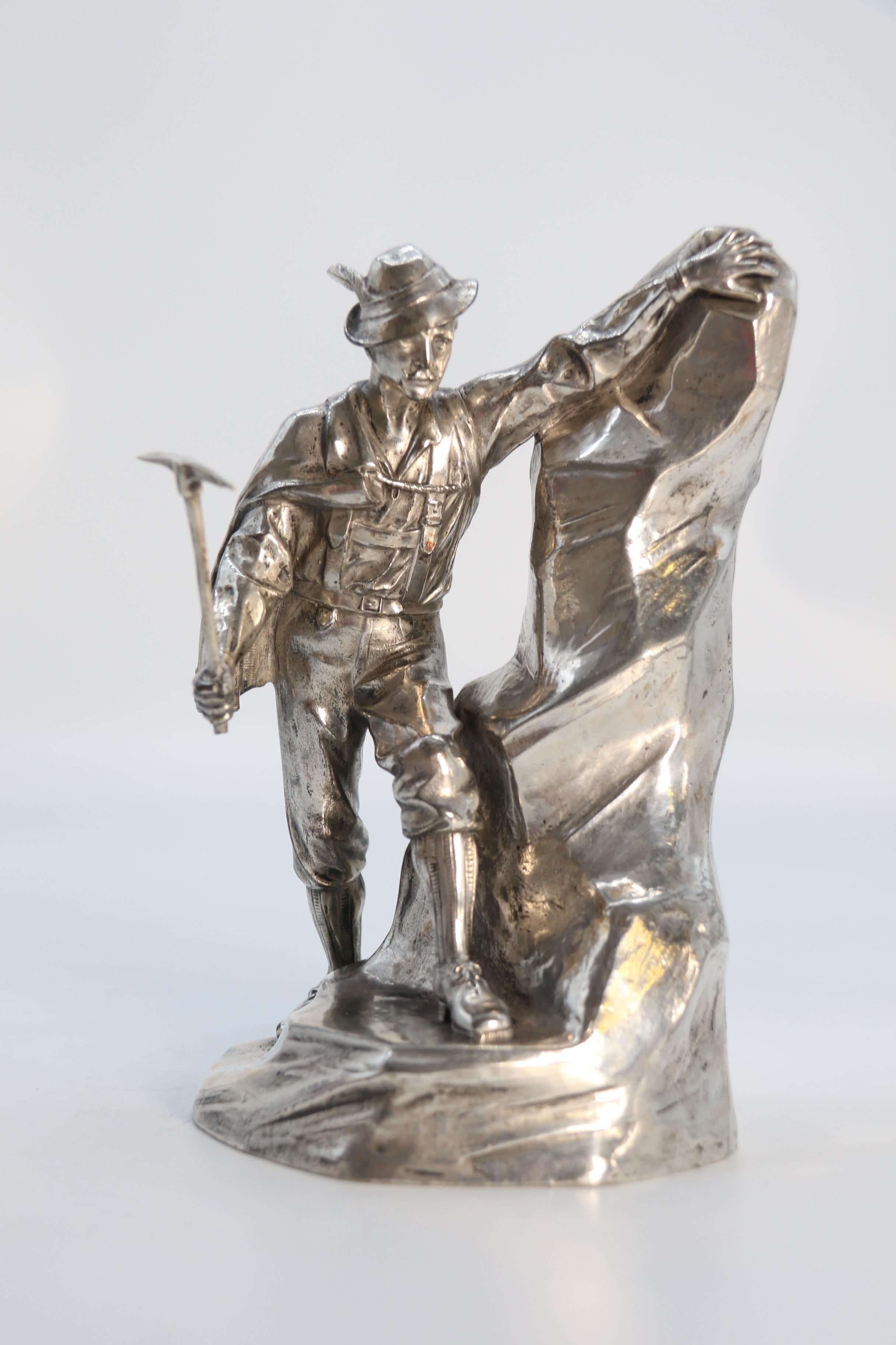 Antique German cast metal and silver plated sculpture of a mountaineer C 1910 11