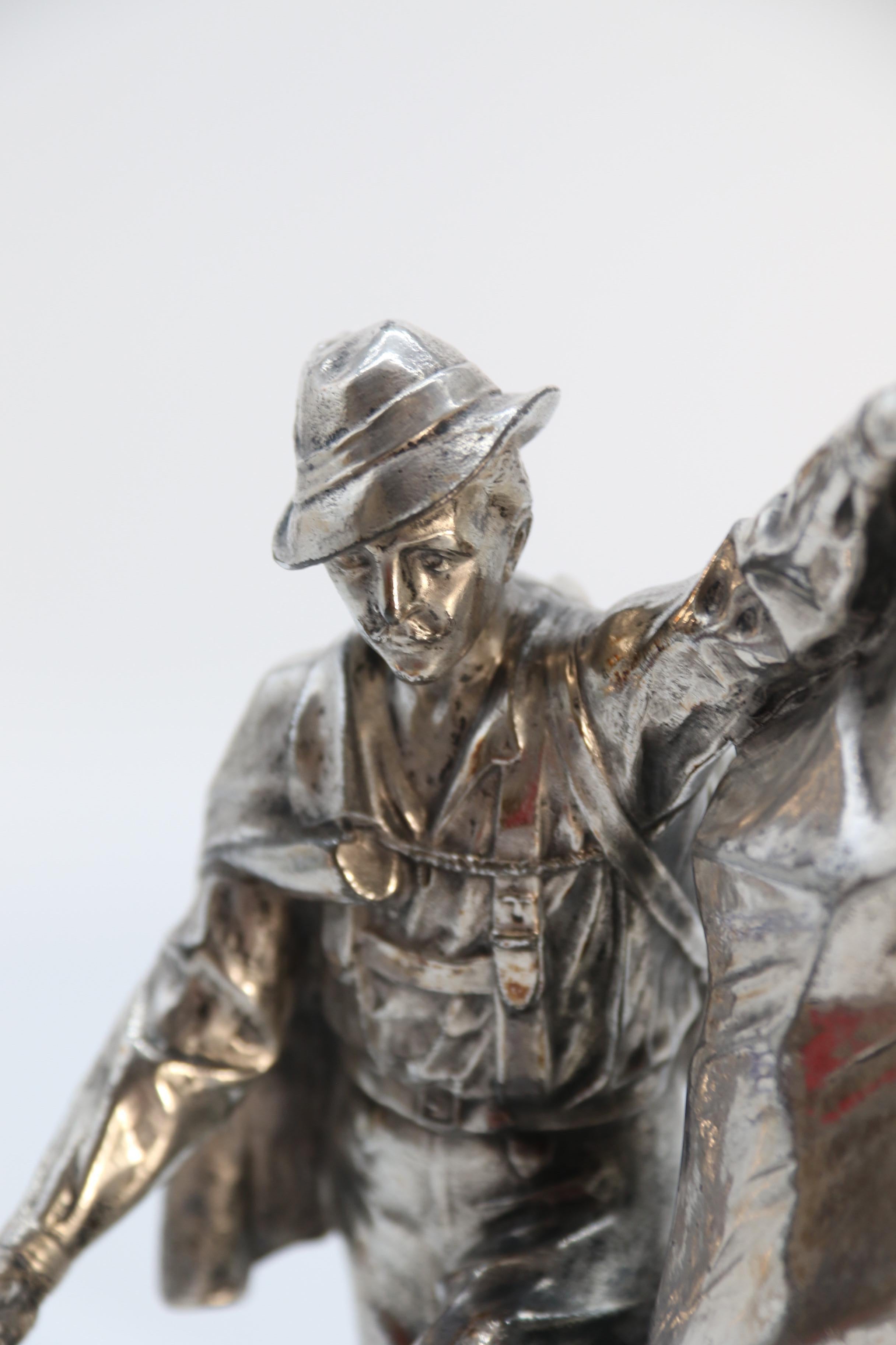 Antique German cast metal and silver plated sculpture of a mountaineer C 1910 12
