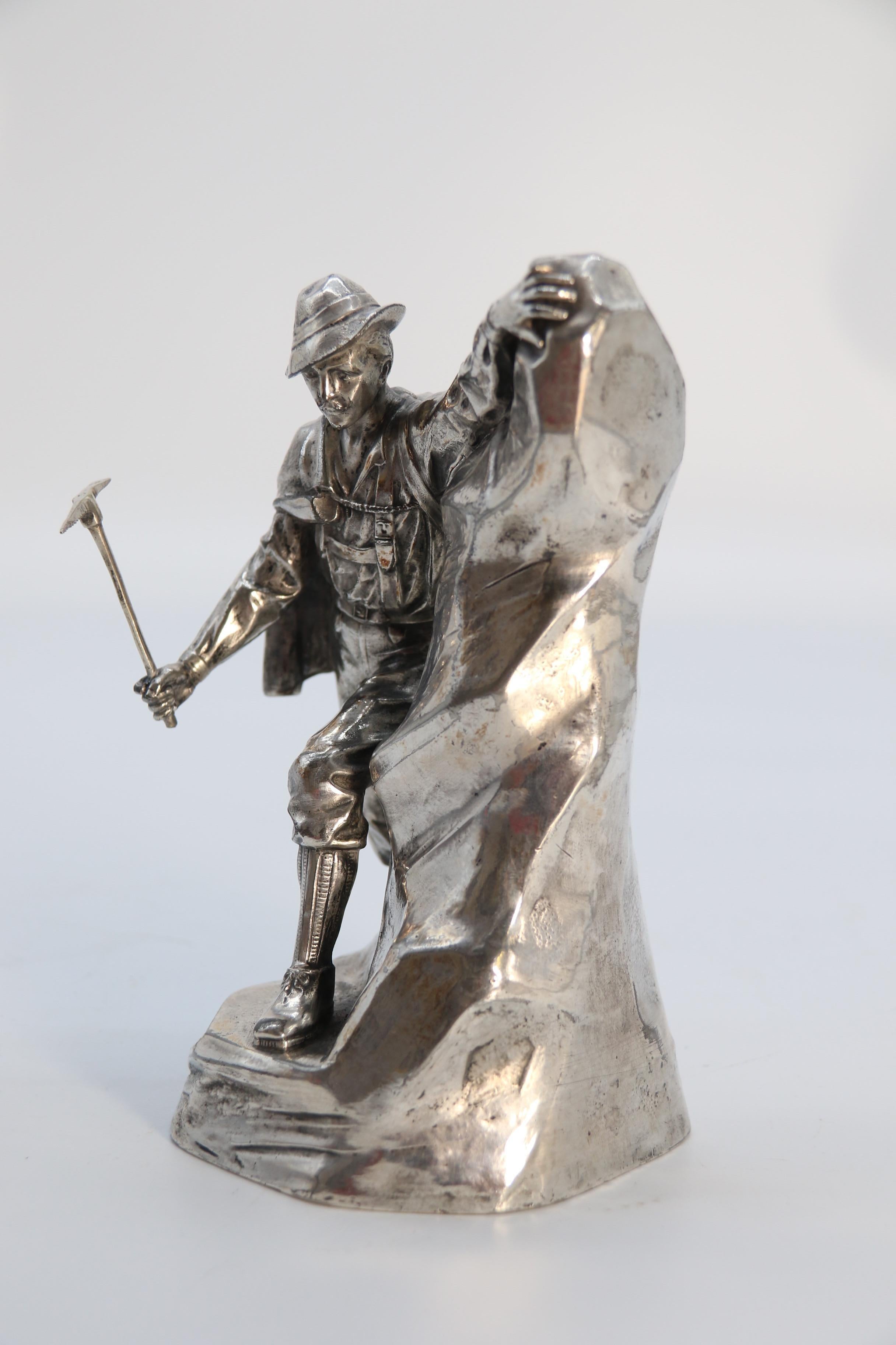 Cast Antique German cast metal and silver plated sculpture of a mountaineer C 1910