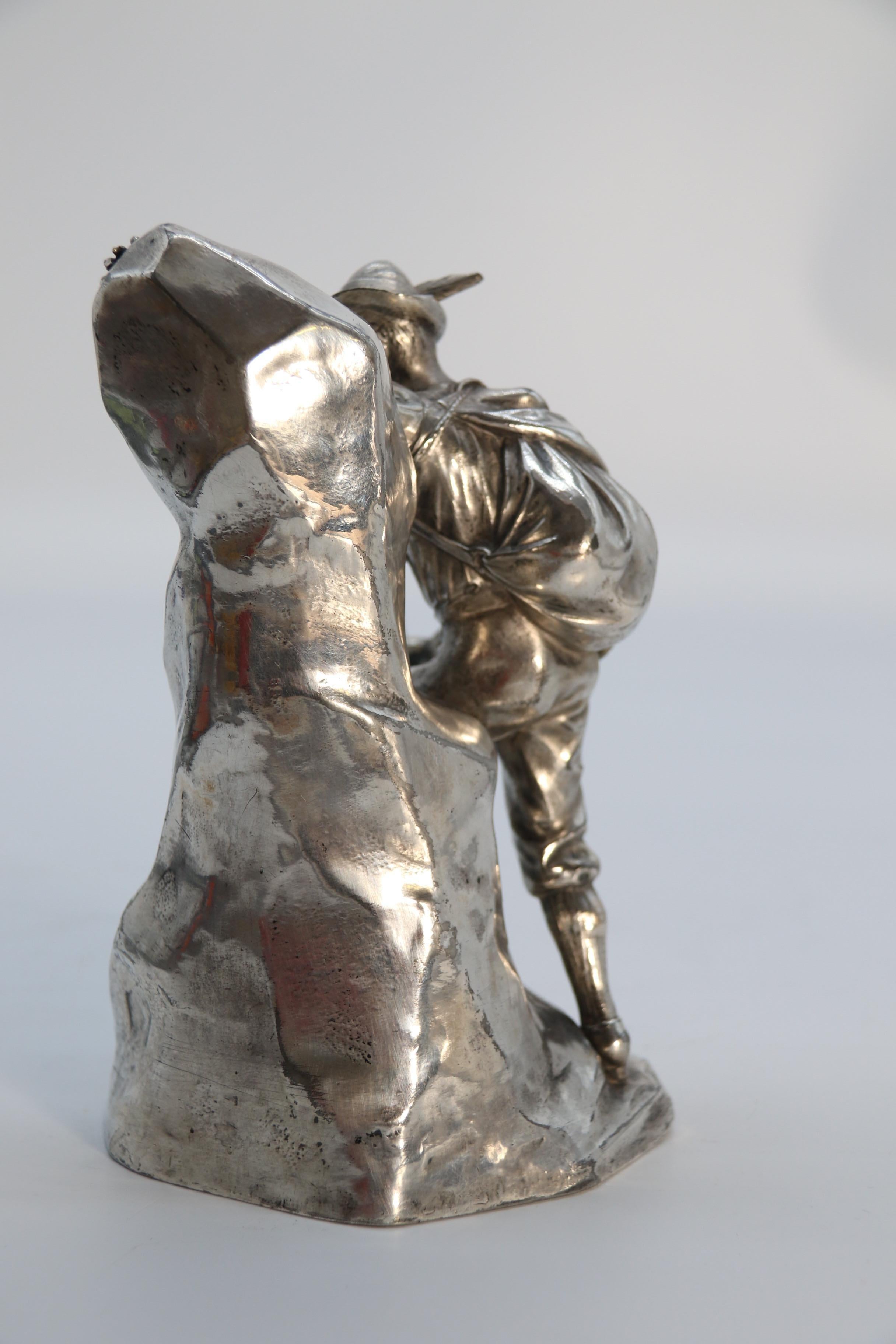 Metal Antique German cast metal and silver plated sculpture of a mountaineer C 1910