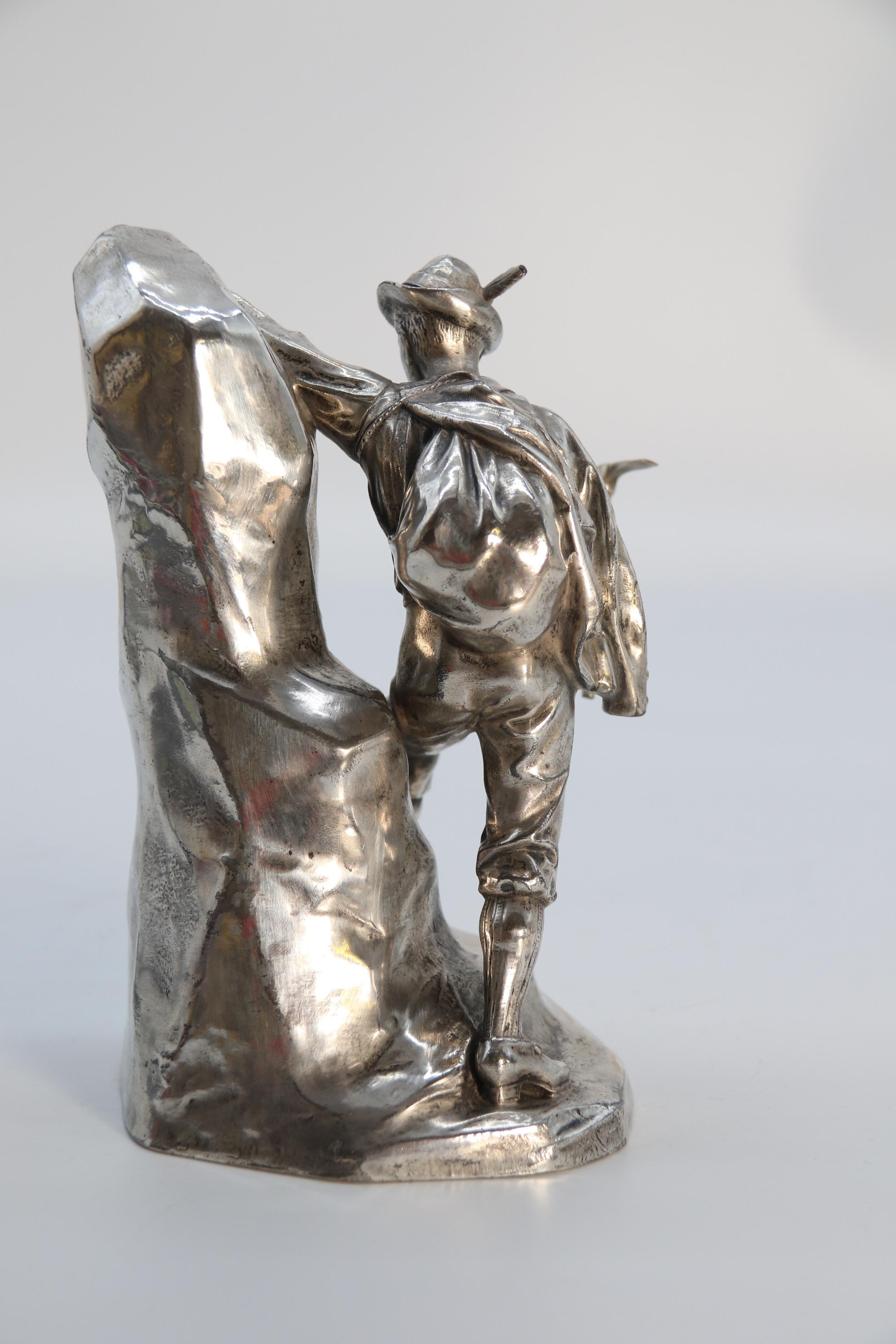 Antique German cast metal and silver plated sculpture of a mountaineer C 1910 1