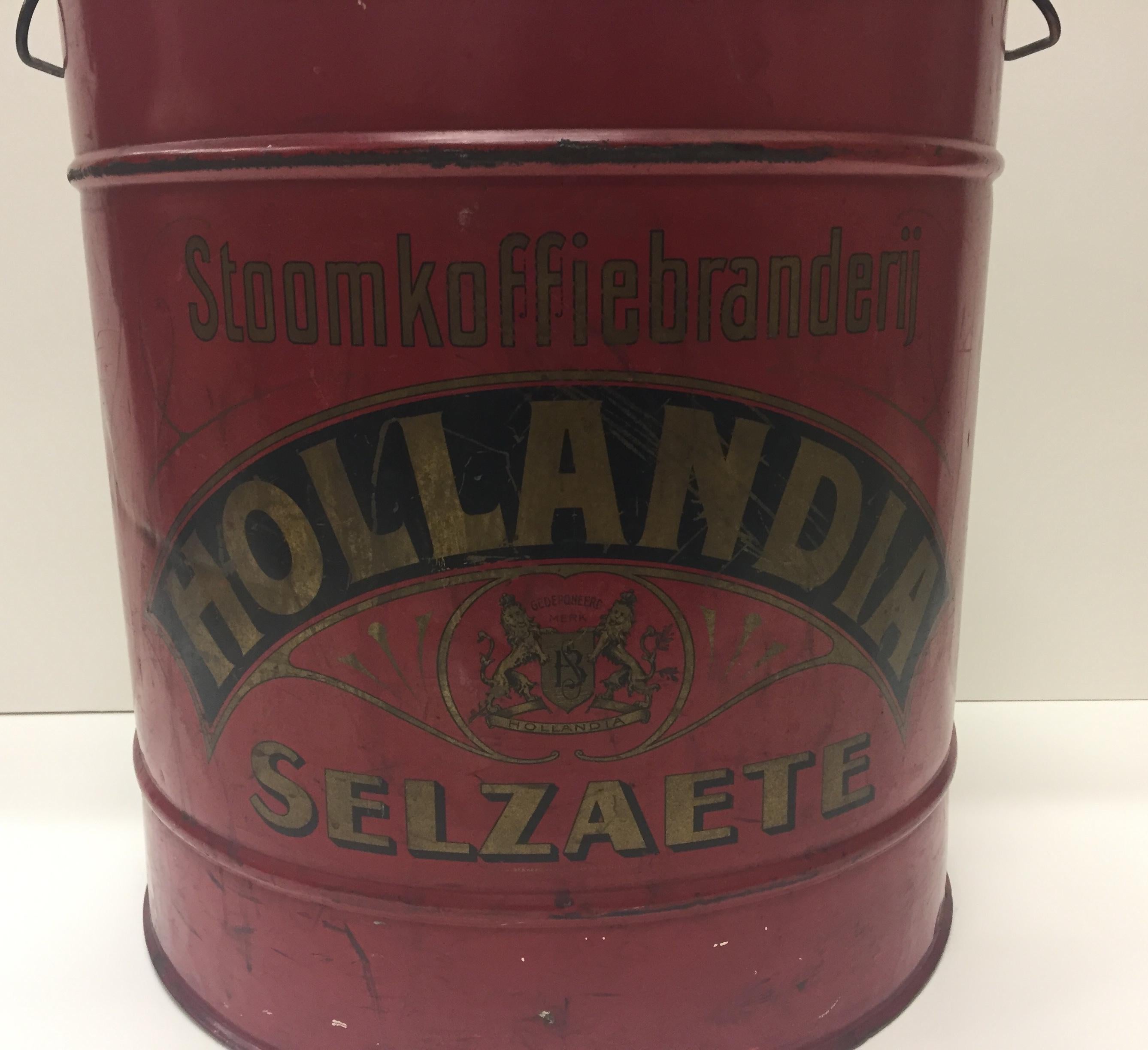 Fabulous vintage object that's an antique coffee tin with original cherry red paint and graphic lettering and a lid that opens and closes.
 