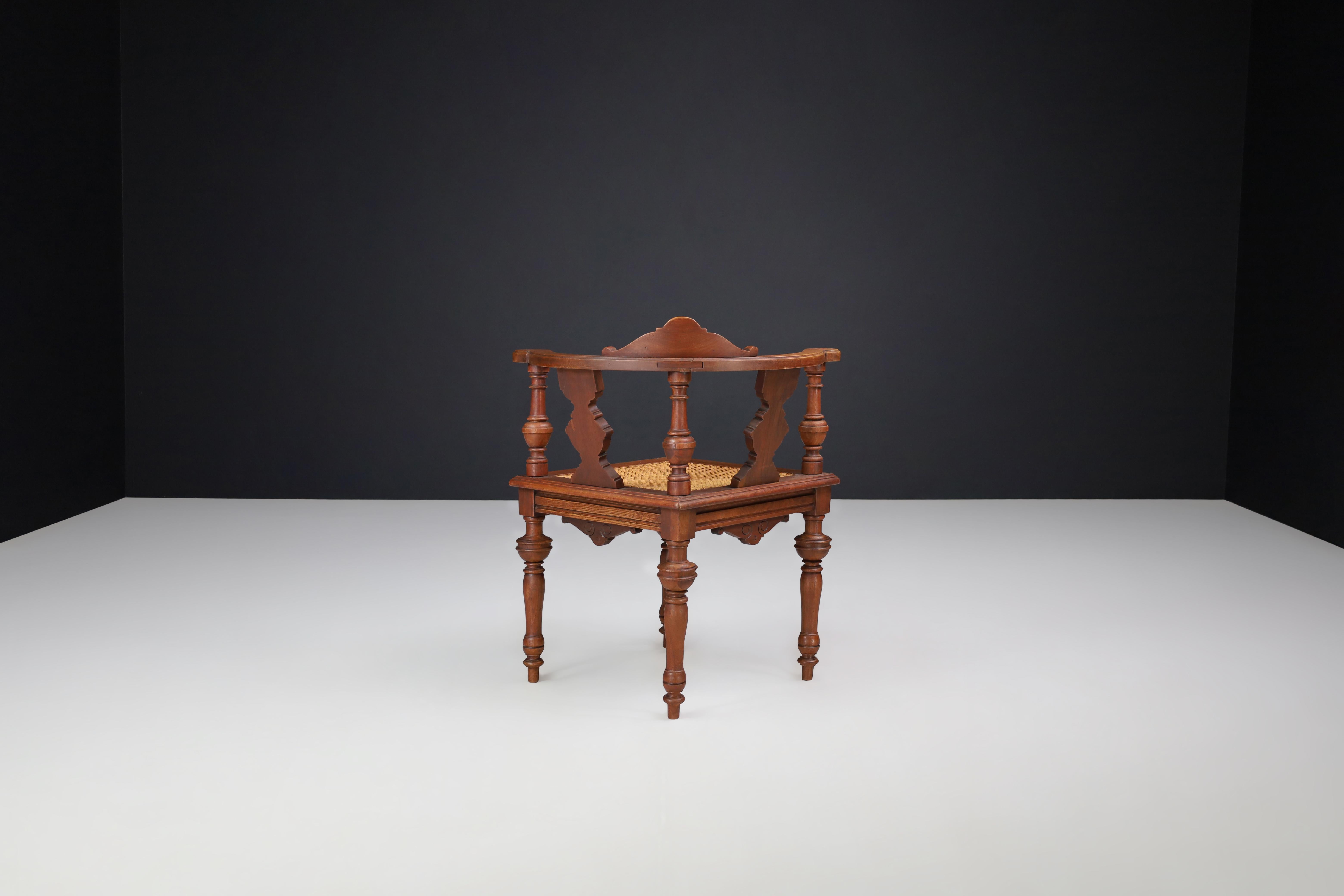 Rococo Antique German Corner Chair, Circa 1880 – Hand-Carved Walnut with Cane Seat For Sale