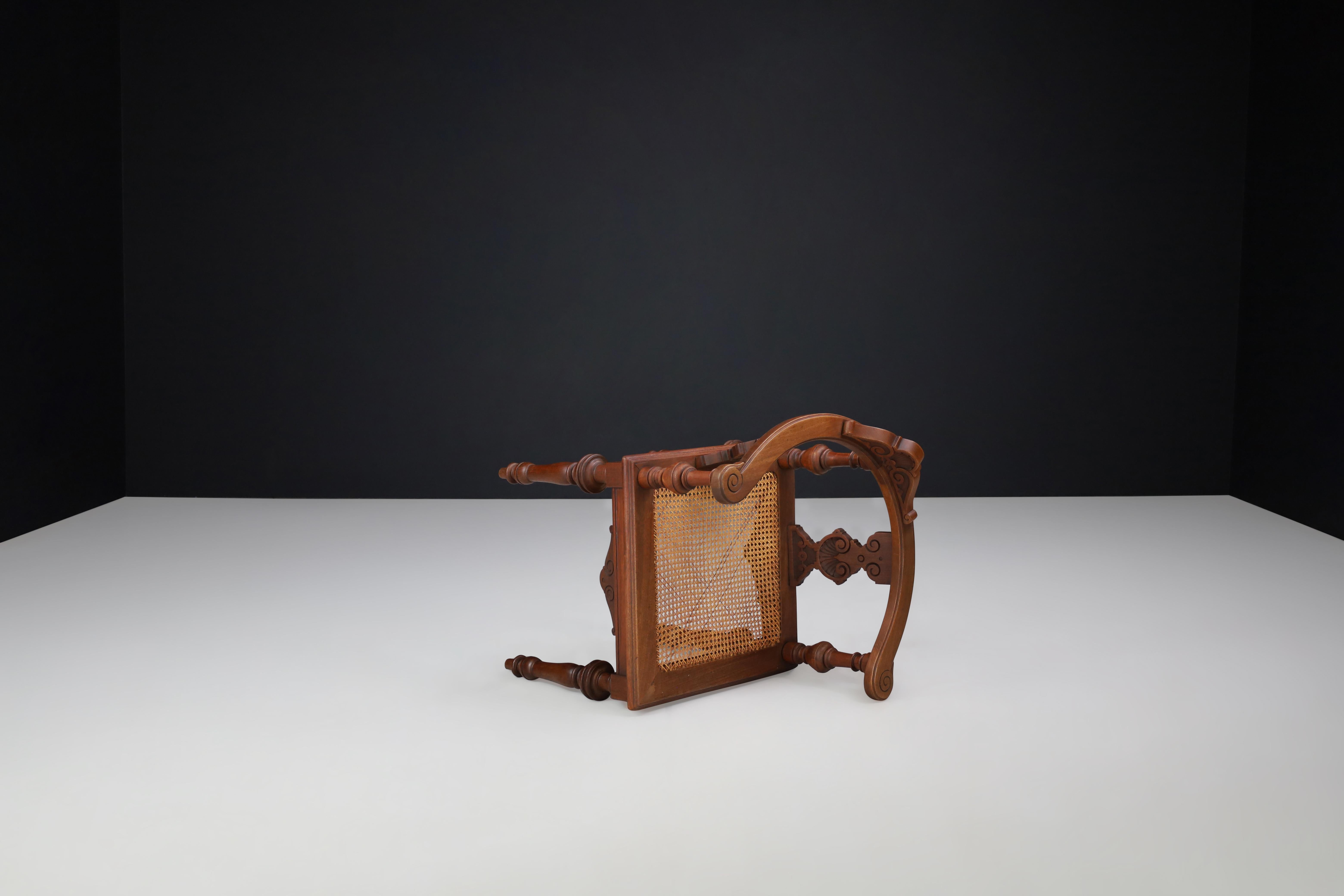 Antique German Corner Chair, Circa 1880 – Hand-Carved Walnut with Cane Seat In Good Condition For Sale In Almelo, NL