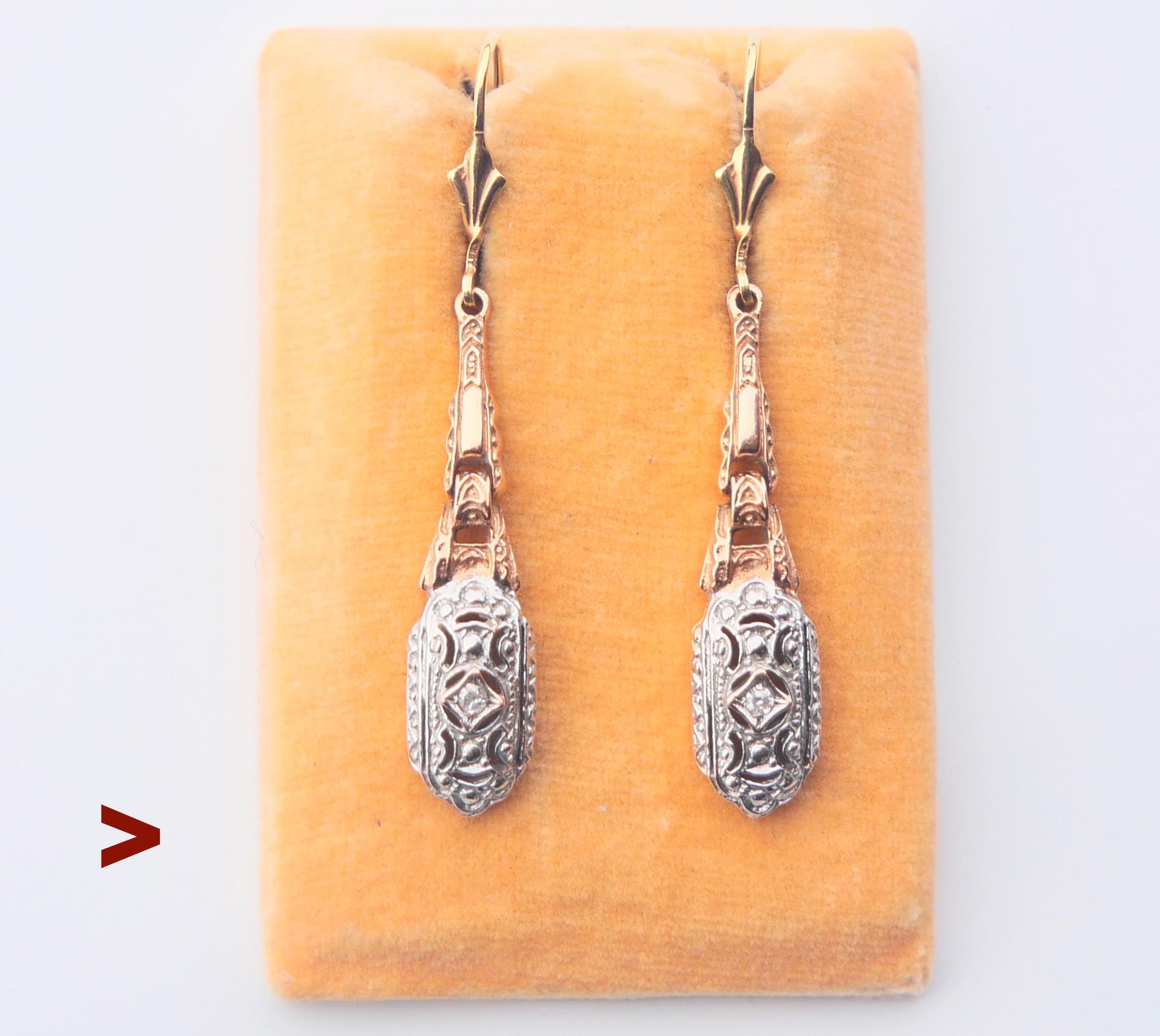 A pair of German dangle earrings from ca. 1930s  decorated with natural Diamonds.

Each hallmarked  585 and  0.02 for actual carat weight of  old European cut Diamonds.

Each earring is 49 mm long x 8mm at widest. 

Weight: 6.75  grams