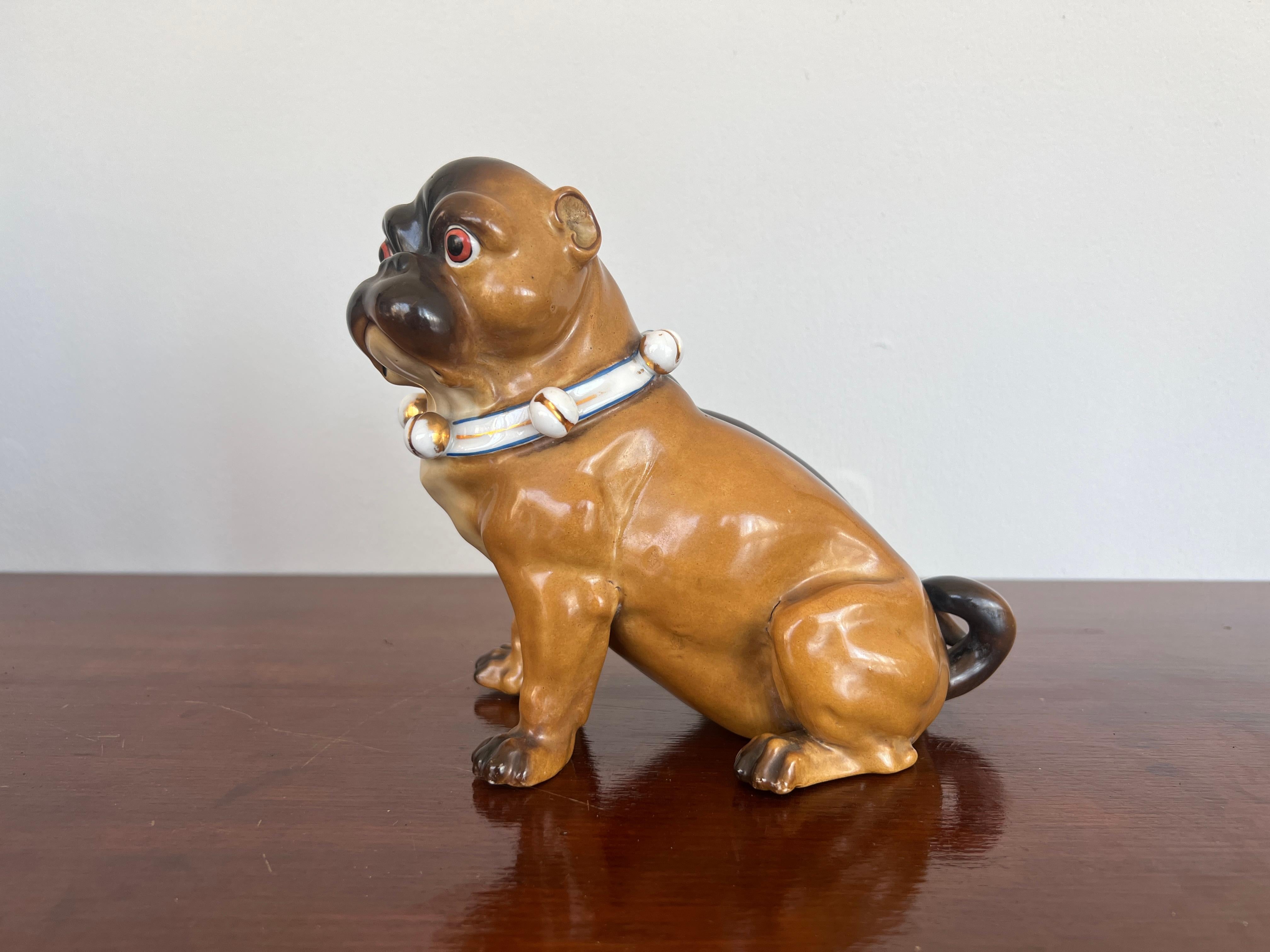 German, late 19th century.

An antique German porcelain model of a seated pug.