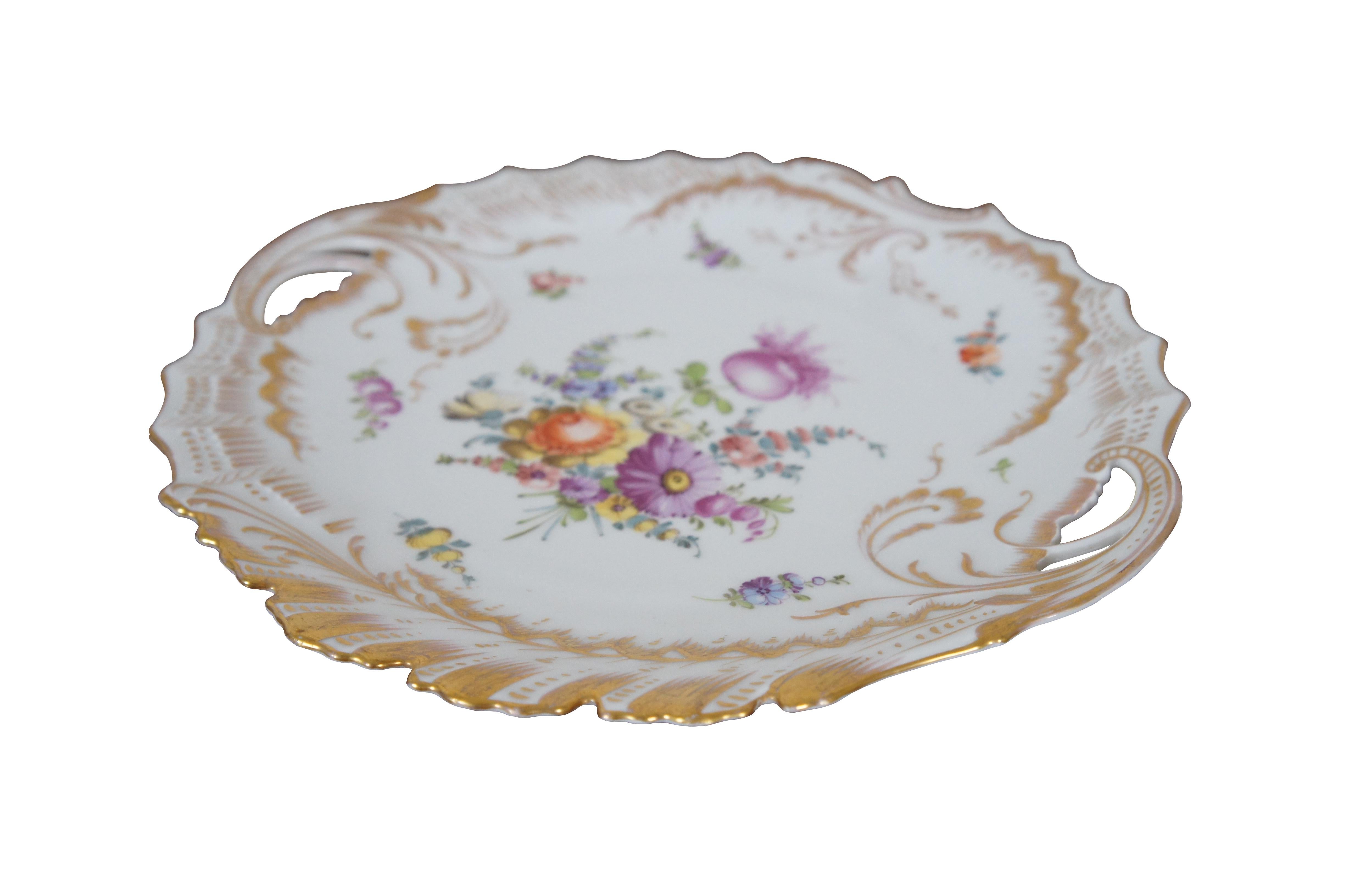 Antique Franziska Hirsch cake plate or platter featuring floral motif with handles and scalloped gold rim.

