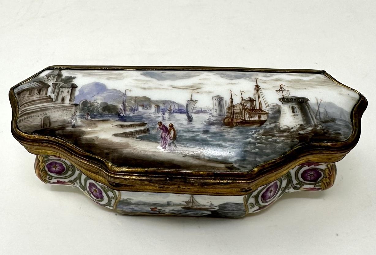 Stunning example of a German hand painted on porcelain ormolu mounted trinket or jewellery box of small proportions, made is Dresden, Germany by Meissen, mid Nineteenth Century.  

The delicate cushioned hinged cover superbly hand painted depicting