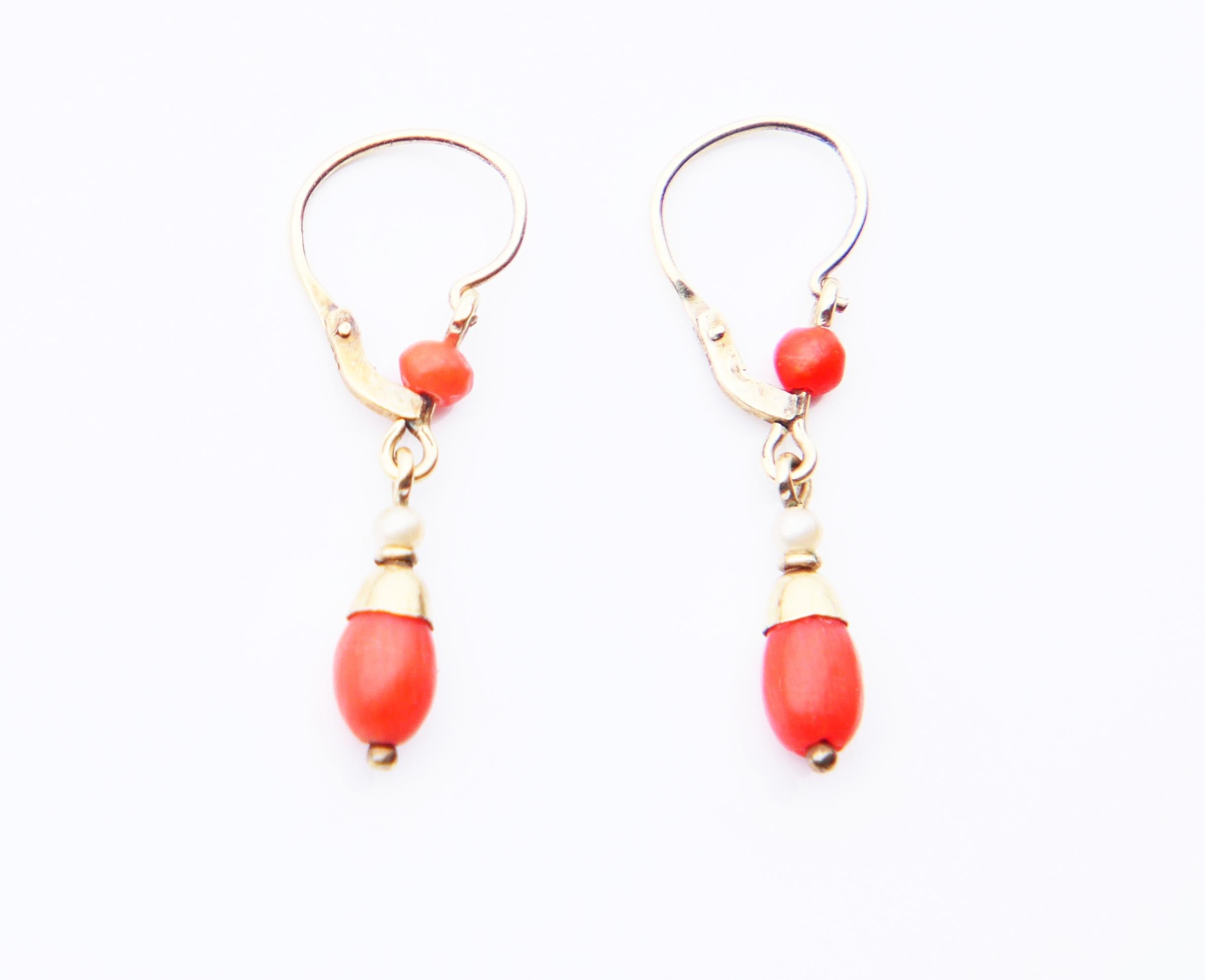 A pair of old German natural Coral and Pearls Earrings with folding hooks . Both hallmarked 585, Gold is Yellow with Green tint, approximate weight of Coral here ca 1ctw,
Each earring is 25 mm long suspended. Weight: 0.9 grams. In finest used