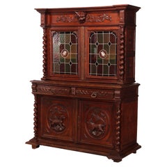 Used German Figural Carved Oak & Leaded Glass Court Cabinet circa 1890