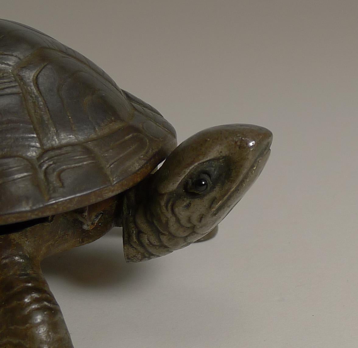 Always sought-after and harder to find these days, this is a genuine antique German novelty counter bell in the from of a tortoise.

This example is unpolished with a good natural antique patina.

The bell is mechanical and when wound up from