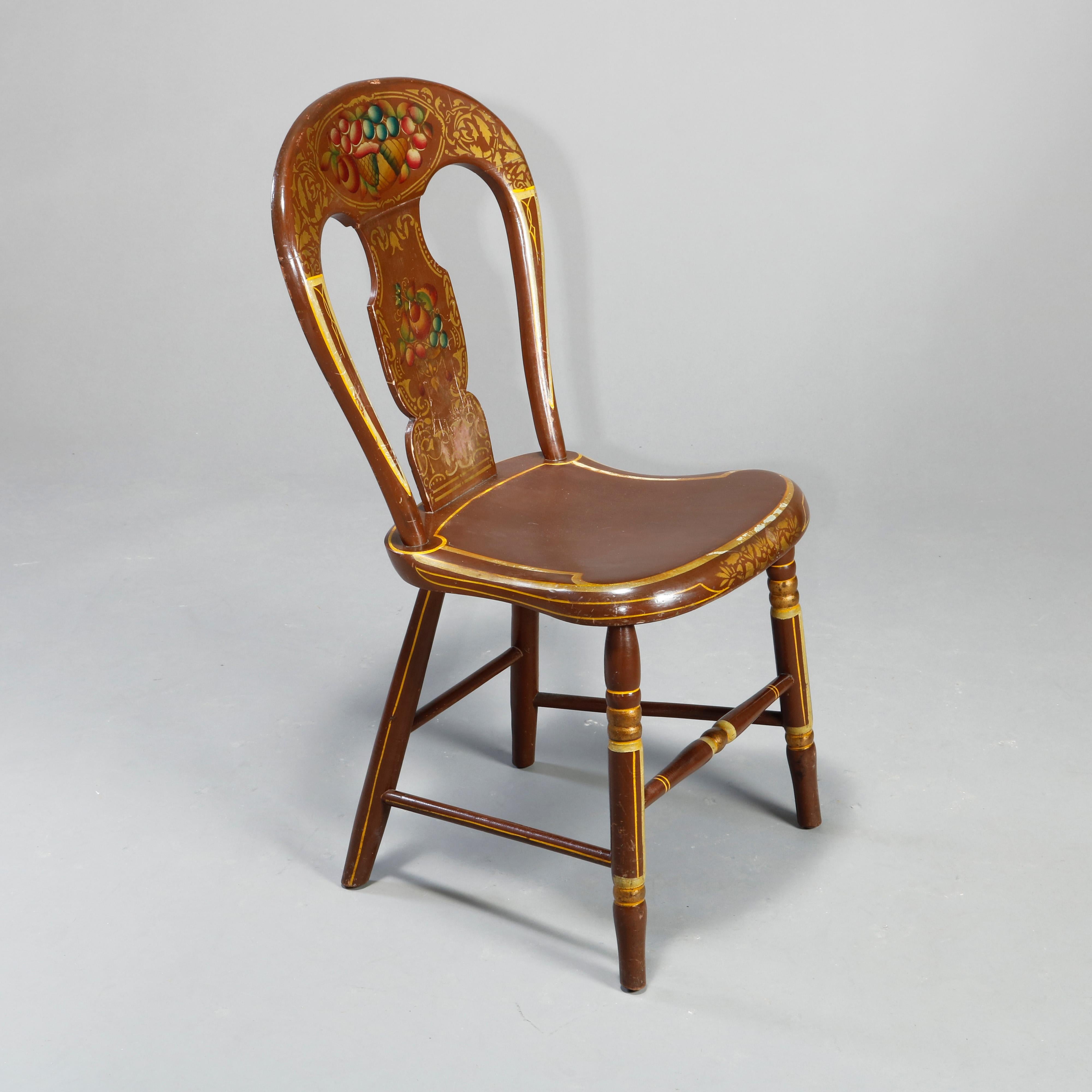 An antique set of six German Folk Art paint decorated chairs offer balloon backs with polychromed and gilt fruit and foliate stencil decoration, plank seats and raised on turned legs, gilt highlights throughout, 19th century

Measures: 33.75
