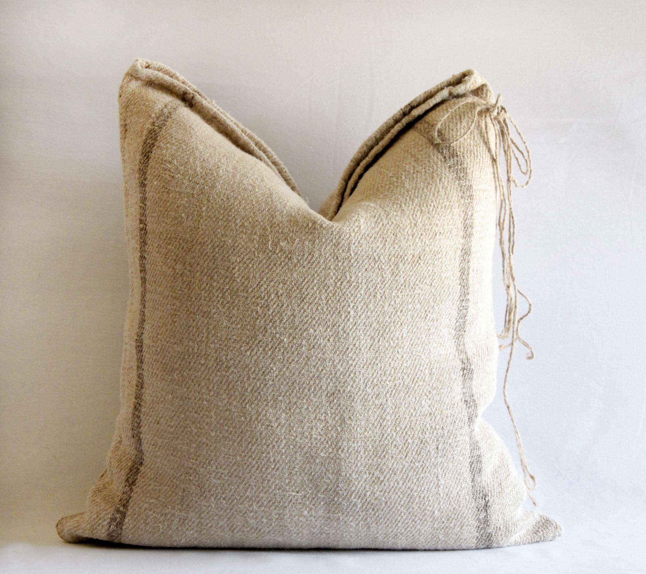 Antique German grain sack pillow with brown stripes
This pillow was made from an original circa 1900s grain sack, thick nubby soft linen and hemp grain sack that has been pre washed, with natural color background and medium brown stripes.
Hidden