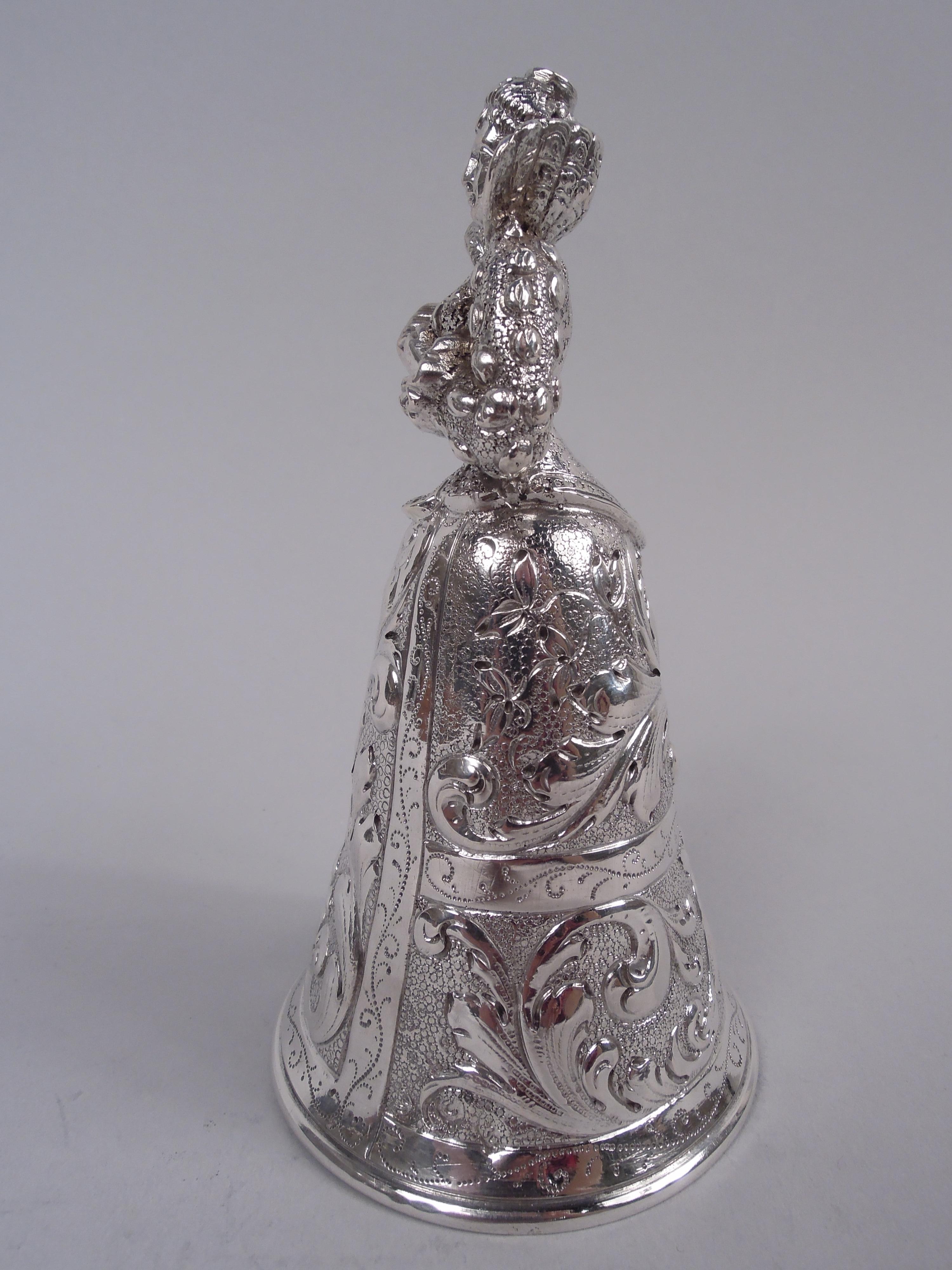 German Baroque 800 silver figural bell in style of wedding cup, ca 1910. A bosomy Jungfrau with tightly laced bodice and standup collar; conical skirt bowl with leafing scrollwork on stippled ground. Hanau maker’s stamp (JD Schleissner & Söhne).