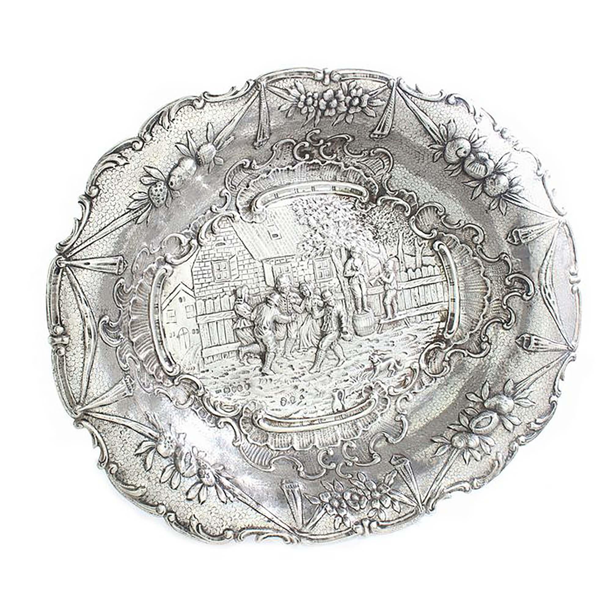 Antique German Hanau silver dish with David Teniers style engravings

Made in Germany, Hanau, Circa 1850's
Imported to London 1893
Importer: Thomas Glaser
Fully hallmarked.

Dimensions:
Size: 18 x 22.5 x 4 cm
Weight: 455 grams

Condition: Minor wear