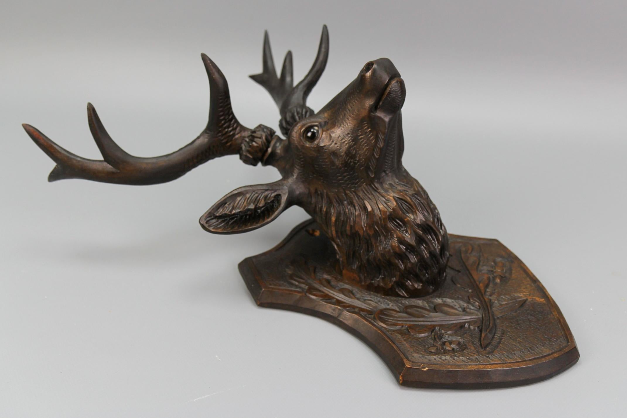 Early 20th Century Antique German Hand Carved Wooden Deer Head with Glass Eyes, ca. 1920 For Sale