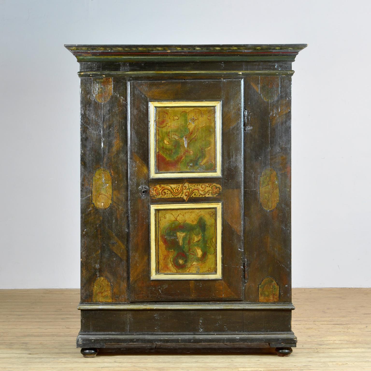 A beautiful one-door cabinet from the rural south of Germany, dating back to the 1820’s The cabinet was probably given as a wedding gift. This cabinet is made of solid pine and is hand painted. The beautiful combination of colors and designs are