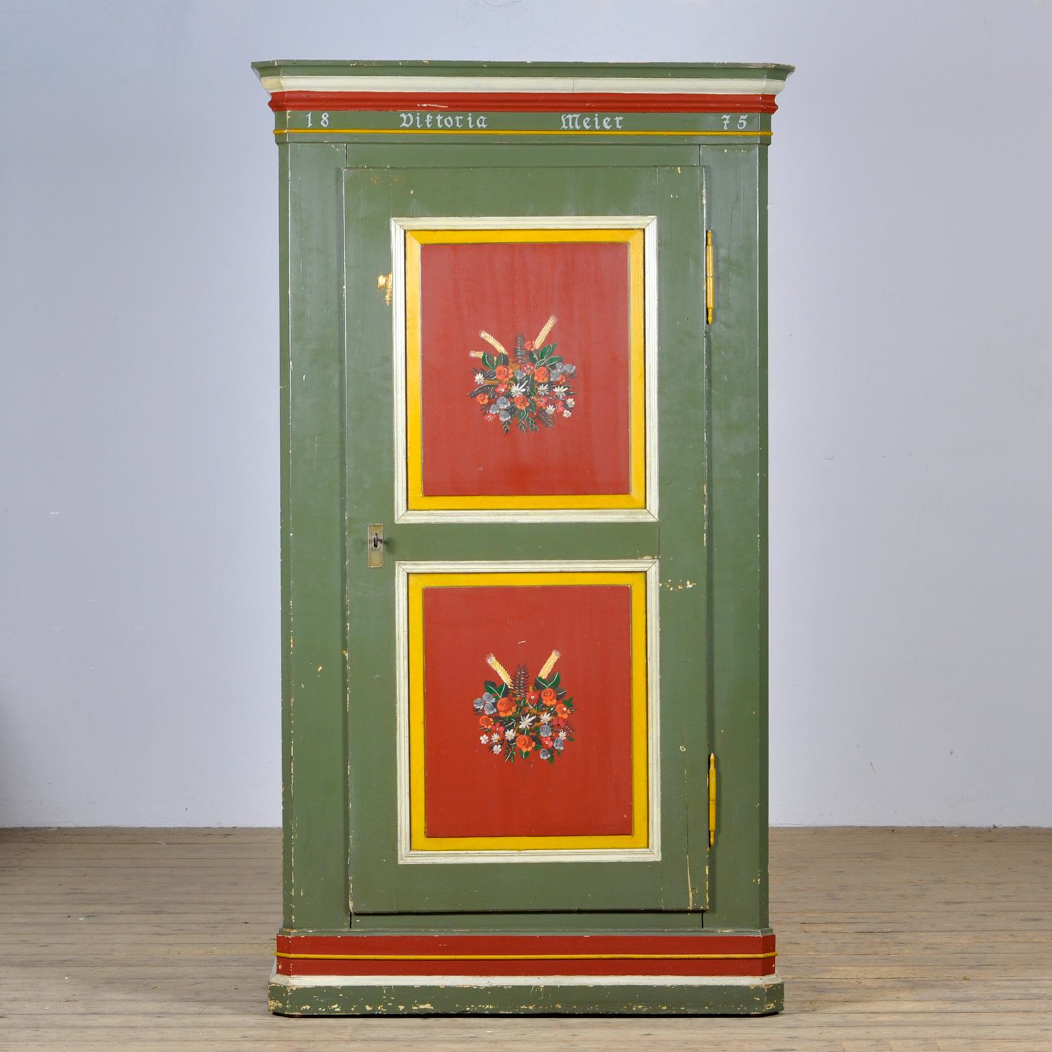 A beautiful single door cabinet from the rural south of Germany. The cabinet was once made for one Victoria Meier in 1875. The cabinet was probably given as a wedding present. This cabinet is made of solid pine and is hand painted in vibrant colors.