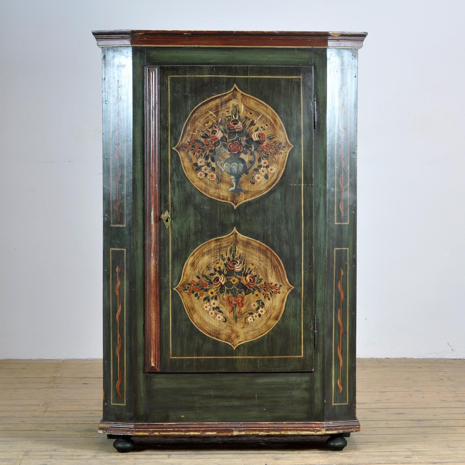 A beautiful cabinet from the rural south of germany, dating from circa 1850. The cabinet was probably given as a wedding present. This cabinet is made of solid pine and is hand painted in vibrant colors. The cabinet has kept its original hinges and