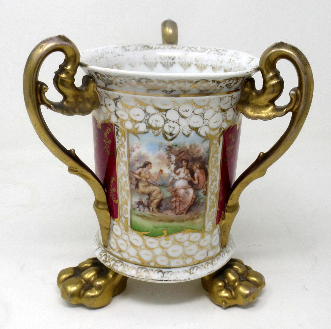 An exceptionally fine quality hand painted Dresden stoneware three handle loving cup of traditional circular flared outline and generous size. Last half of the nineteenth century.  

With three hand painted classical scenes of Ladies in landscape