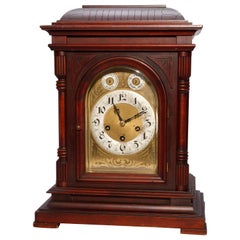 Antico orologio a staffa tedesco in mogano intagliato Junghan, 1910 circa