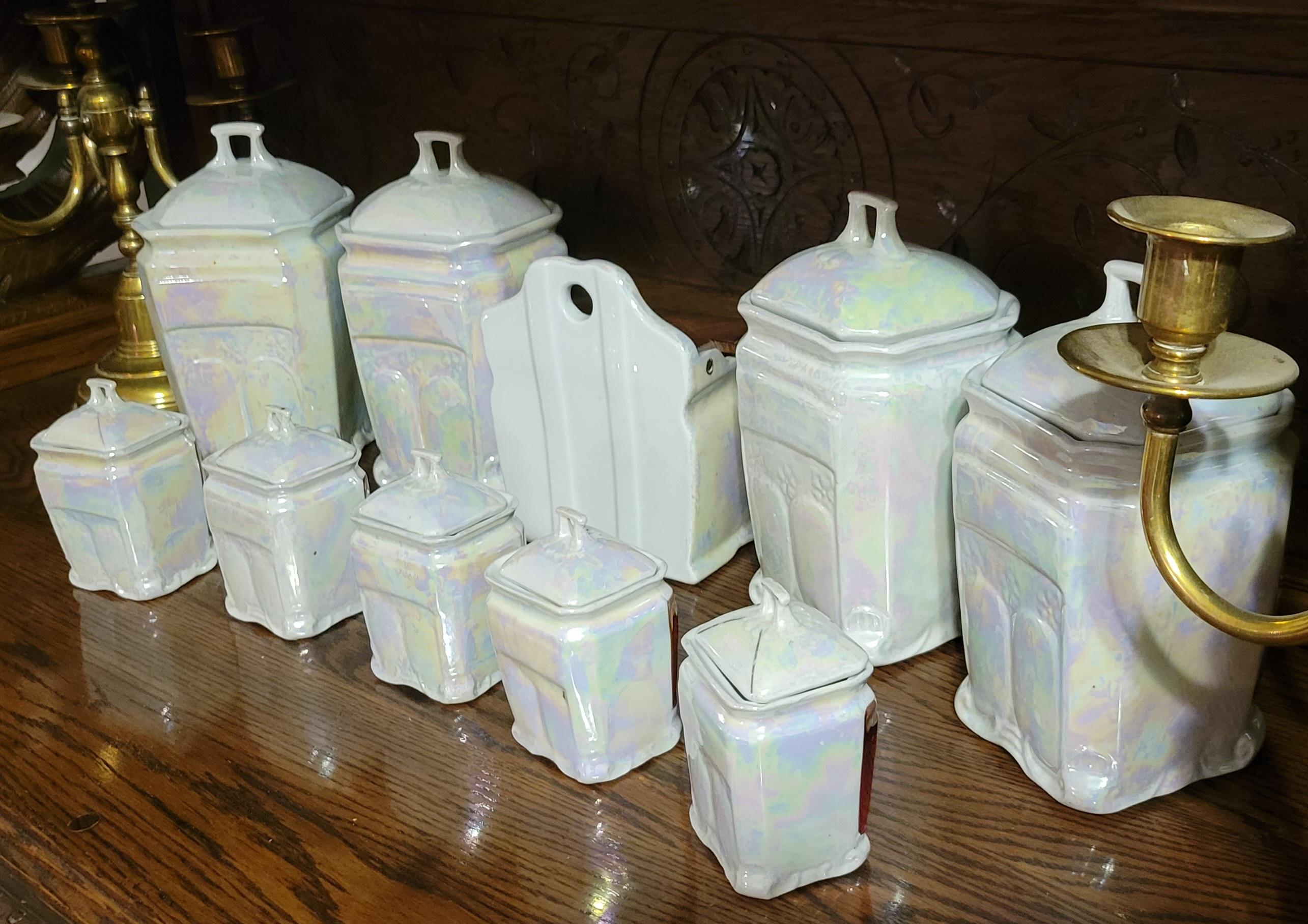 A set of 10 lusterware German porcelaine canisters.
A set includes:
(4) large canisters: Rice, Flower, Coffee, Sugar - about 5