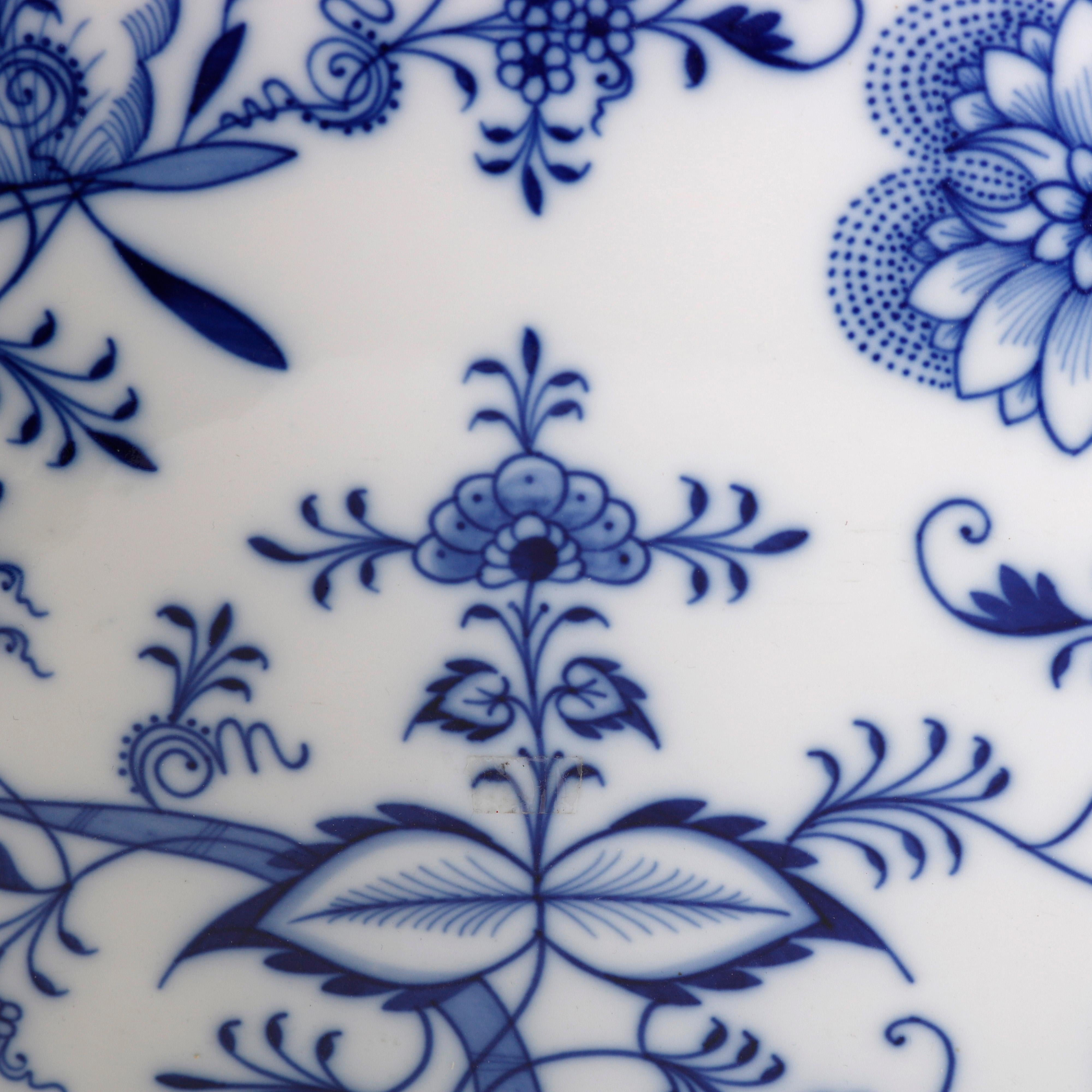 An antique German Meissen platter offers porcelain construction with Blue Onion pattern and scalloped rim, stamped on base as photographed, circa 1900

Measures- 21.25