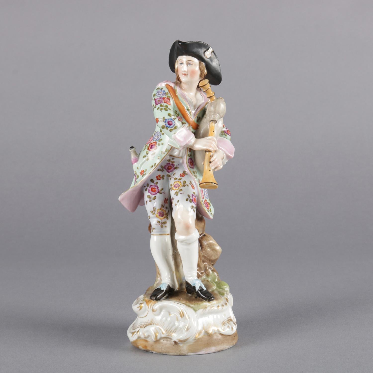 Antique German Meissen school hand painted and gilt figurine features bagpiper in countryside setting, marked on base as photographed, 19th century

Measures: 7.5