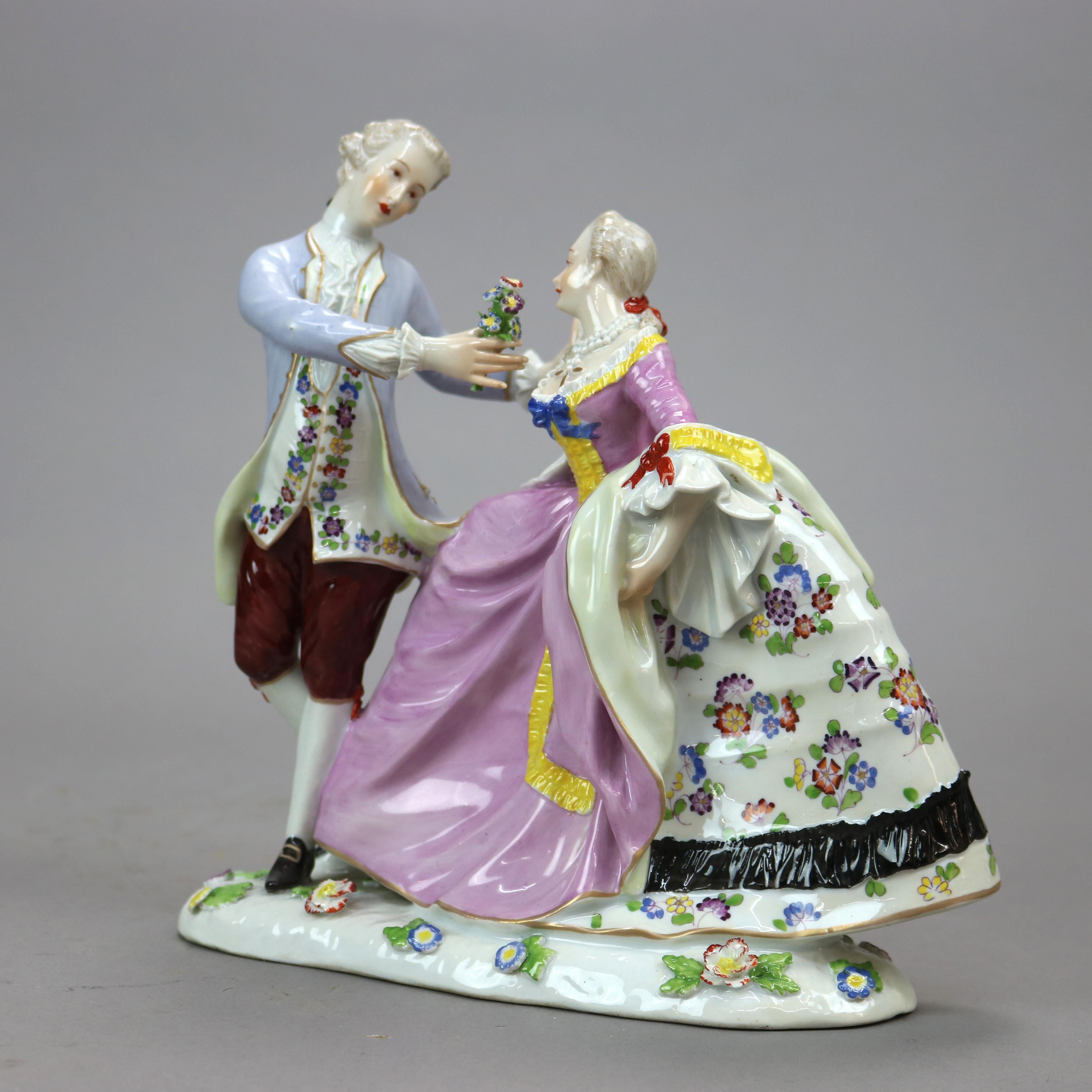 An antique German figural group in the manner of Meissen offers hand painted and gilt porcelain courting scene with young man and woman in countryside setting, early 20th century

Measures - 8.25'' H x 8.75'' W x 4'' D.