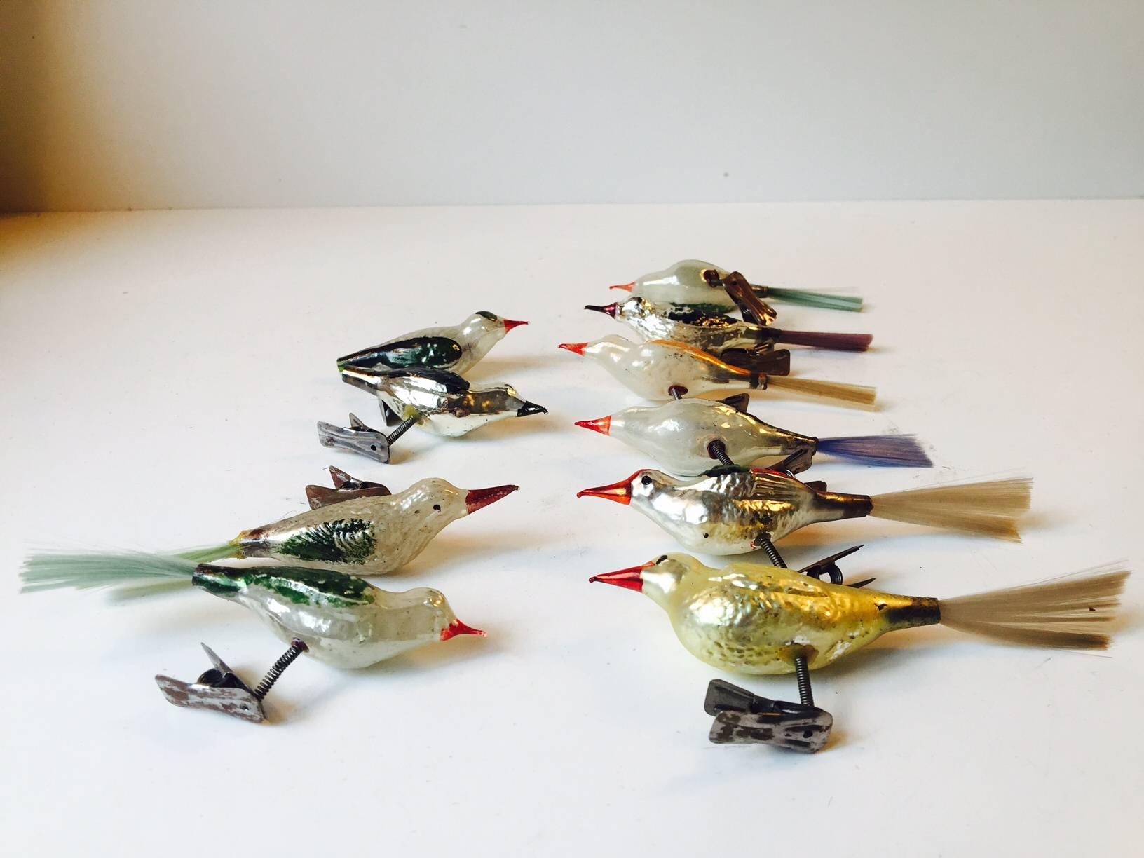 A colorful antique lot of ten clip on birds ornament in a variety of different colors. These ornaments, made from ultra-thin handblown mercury glass, would be a great antique addition for your Christmas, Feather Tree or sitting on a decorative